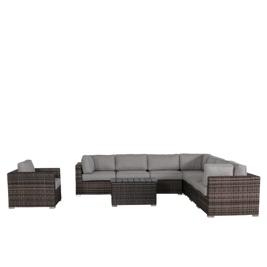 Rattan sectional outdoor sofa with grey cushions and a wicker coffee table