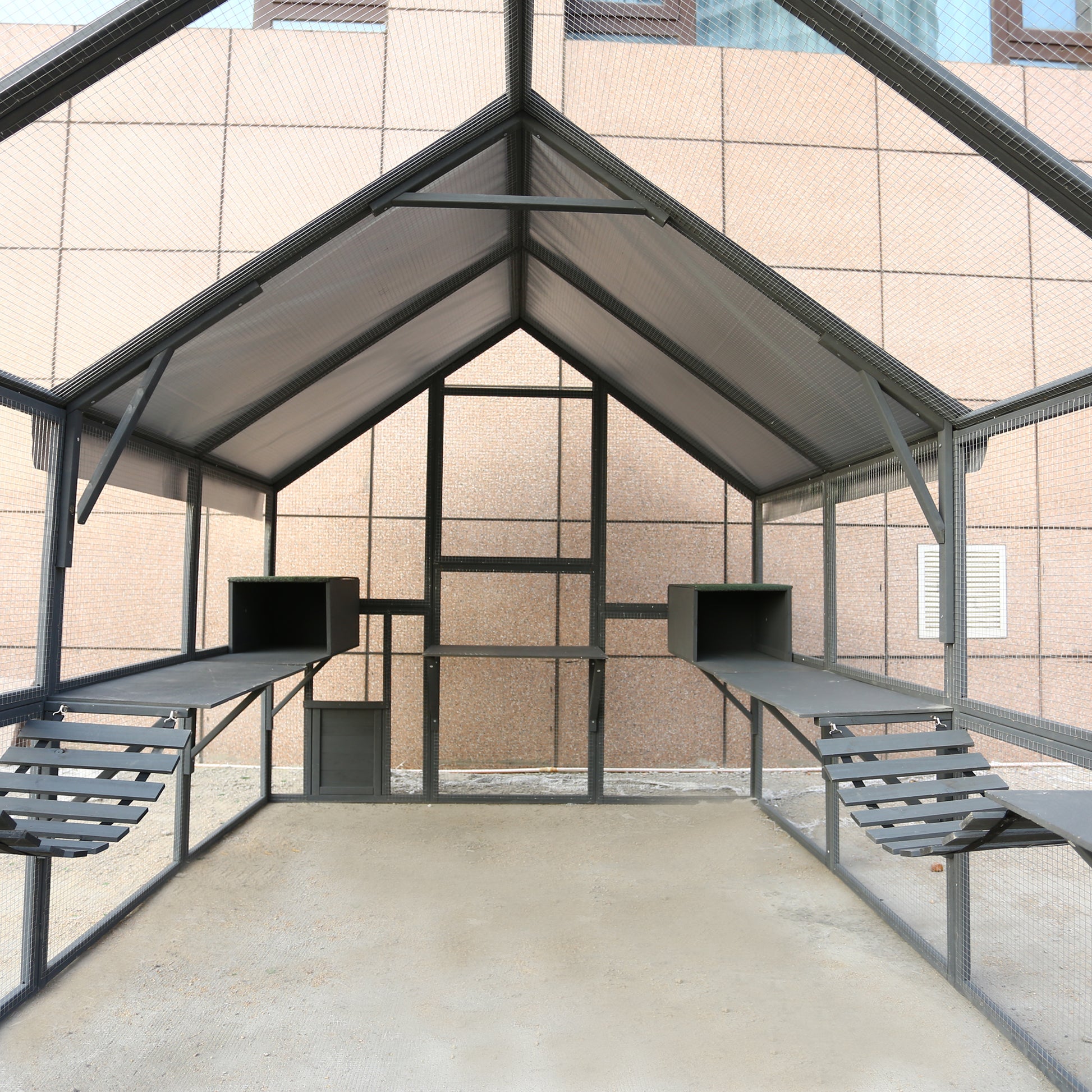 Spacious grey metal outdoor cat enclosure with twolevel platforms and integrated scratching posts