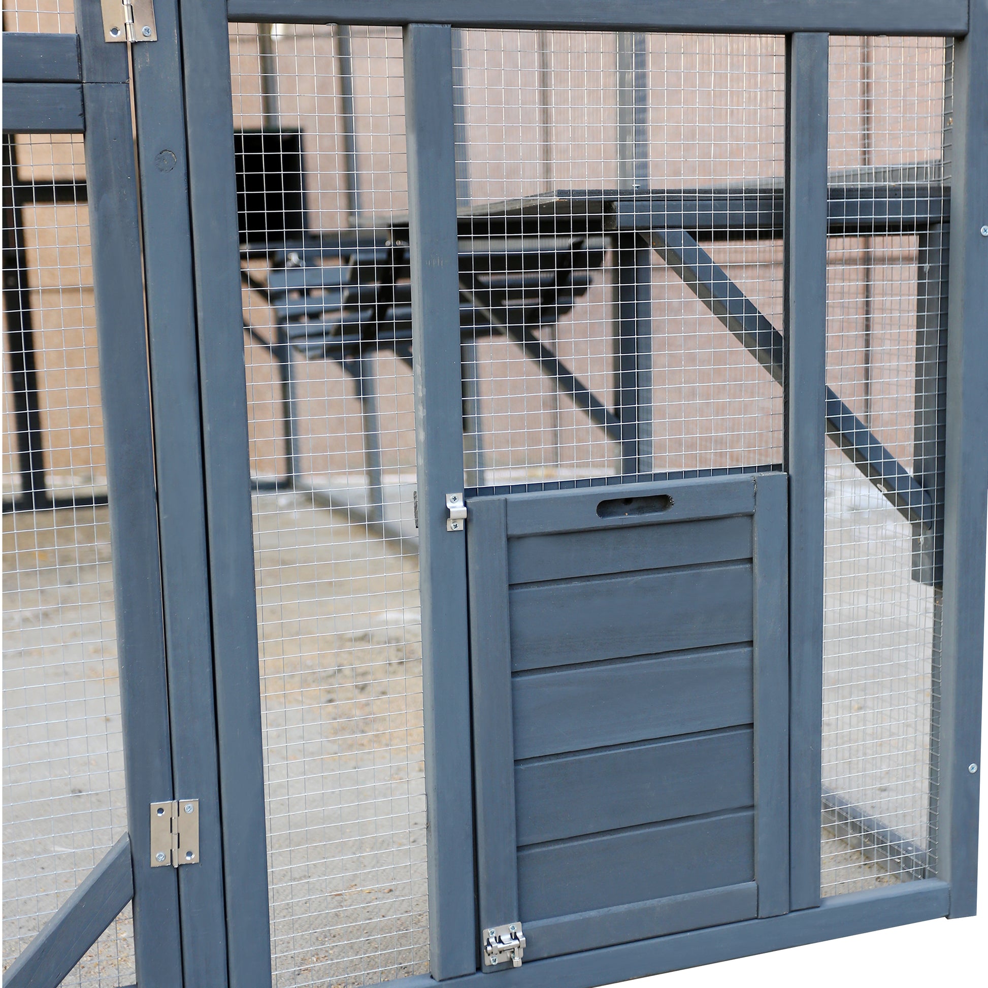 Dark gray wooden pet run with wire mesh and a small wooden door designed for outdoor use