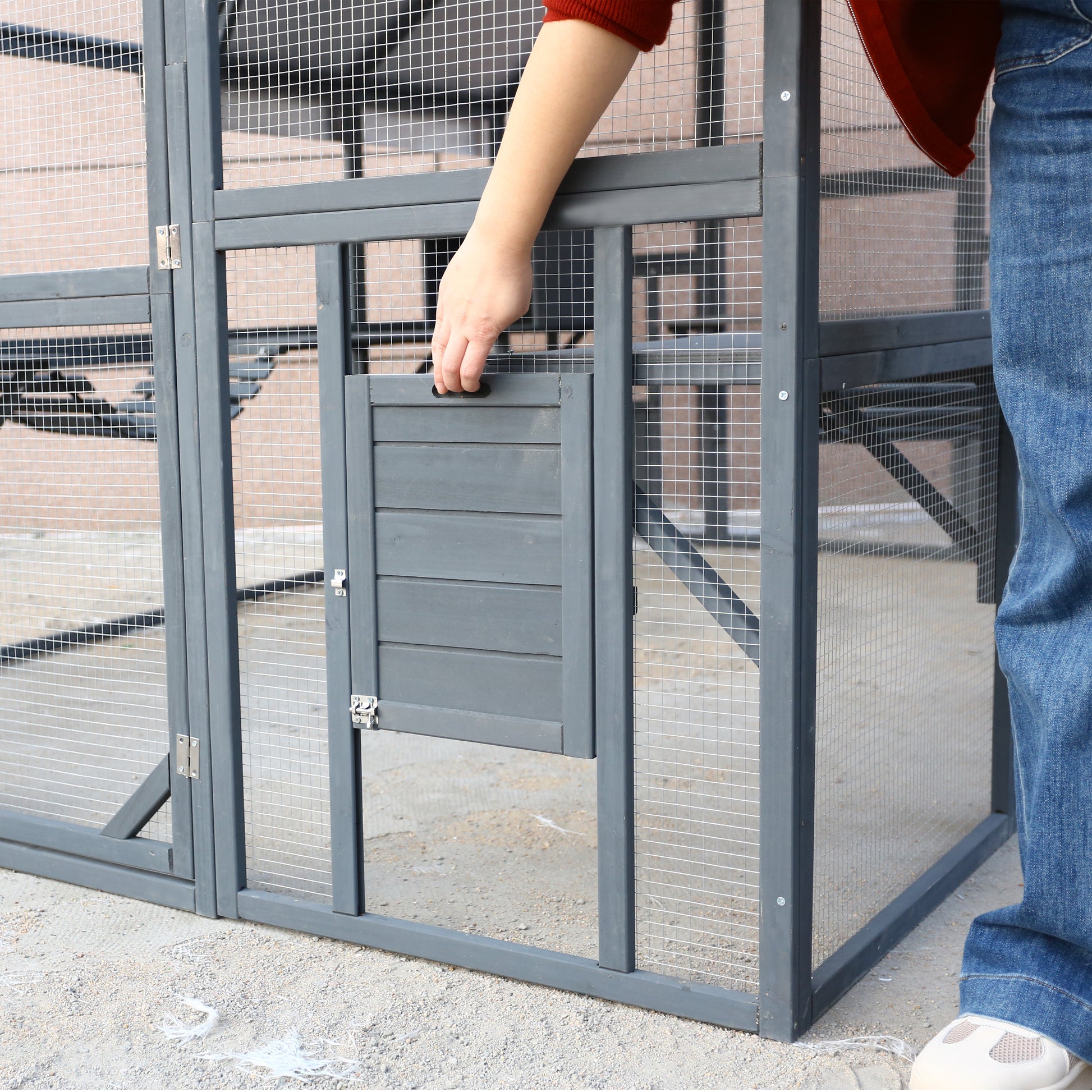 Grey wooden outdoor pet enclosure with accessible ramp access