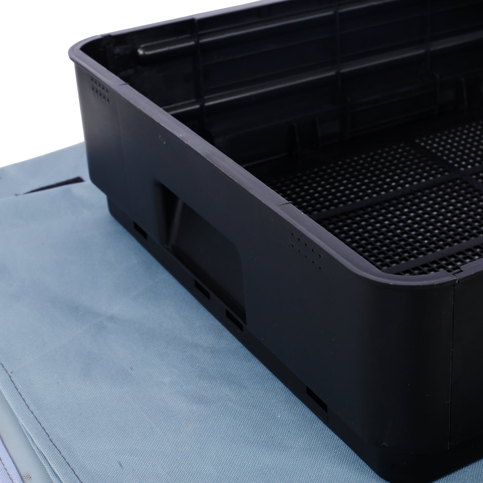 Black plastic storage crate with ventilation holes ideal for organizing