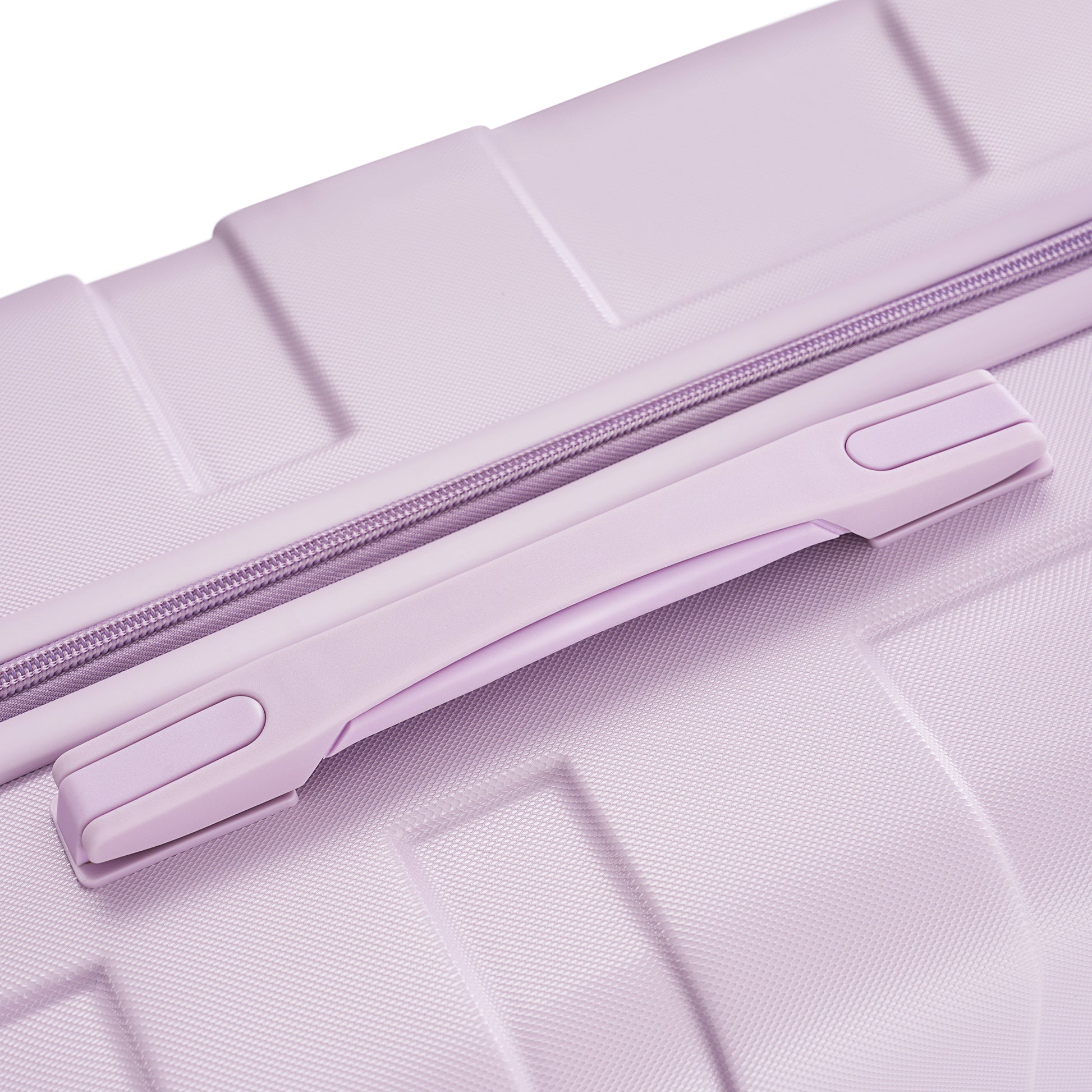 Closeup of a lilac suitcase textured shell and purple zipper detail