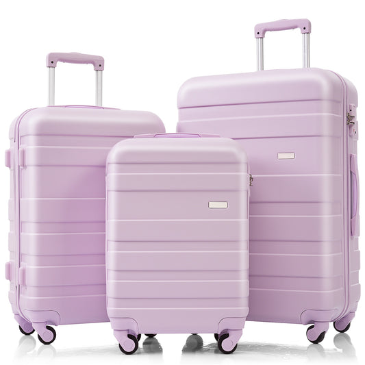 Three lavender hardshell suitcases in various sizes perfect for travel