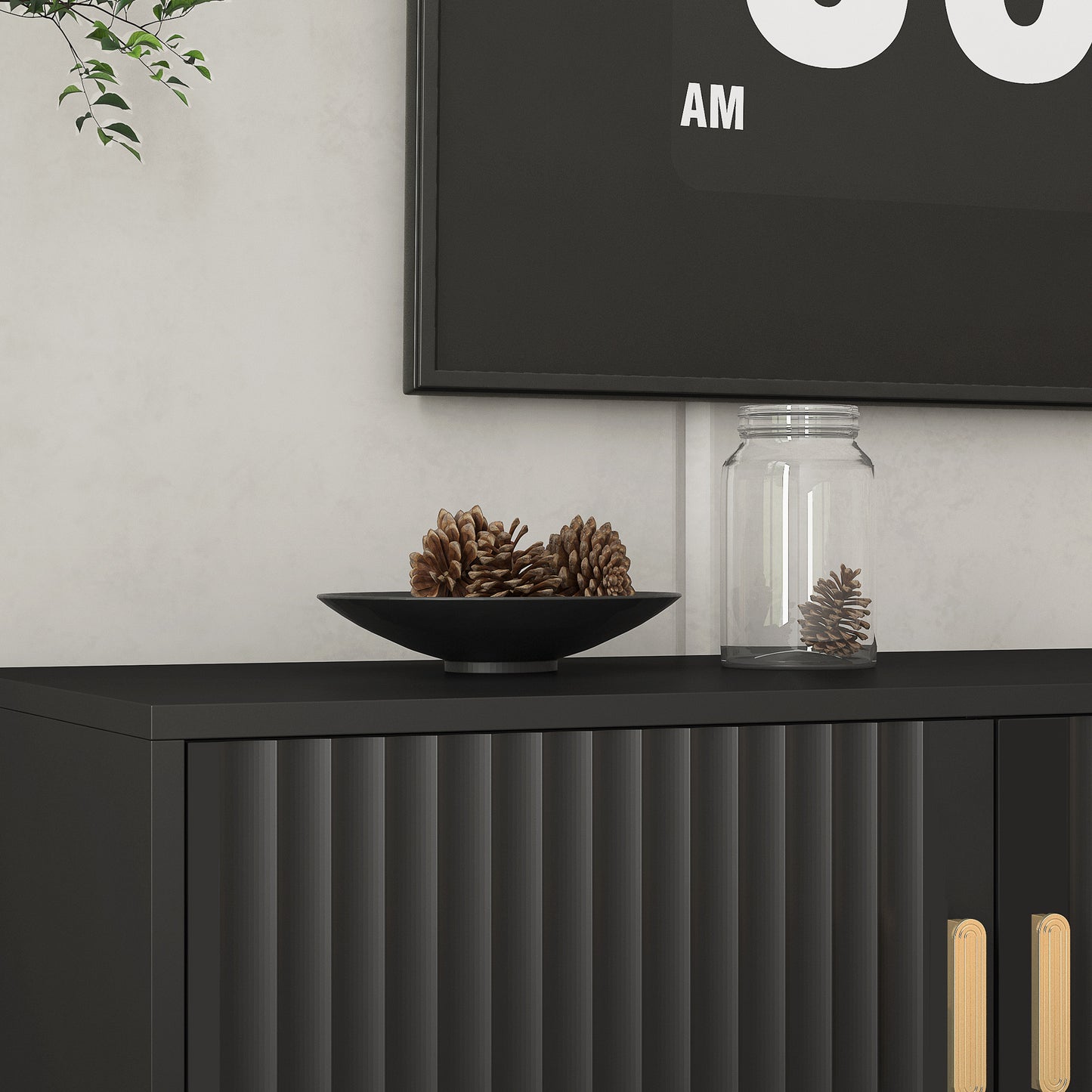 Black ribbed cabinet with modern gold handles and decorative pinecones