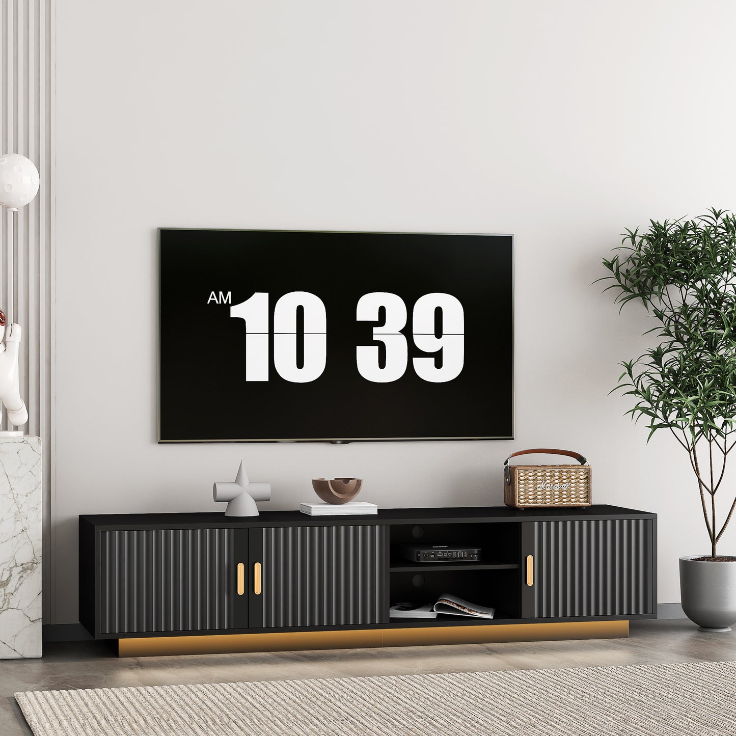 Black fluted media console with gold hardware and slatted doors perfect for modern living rooms