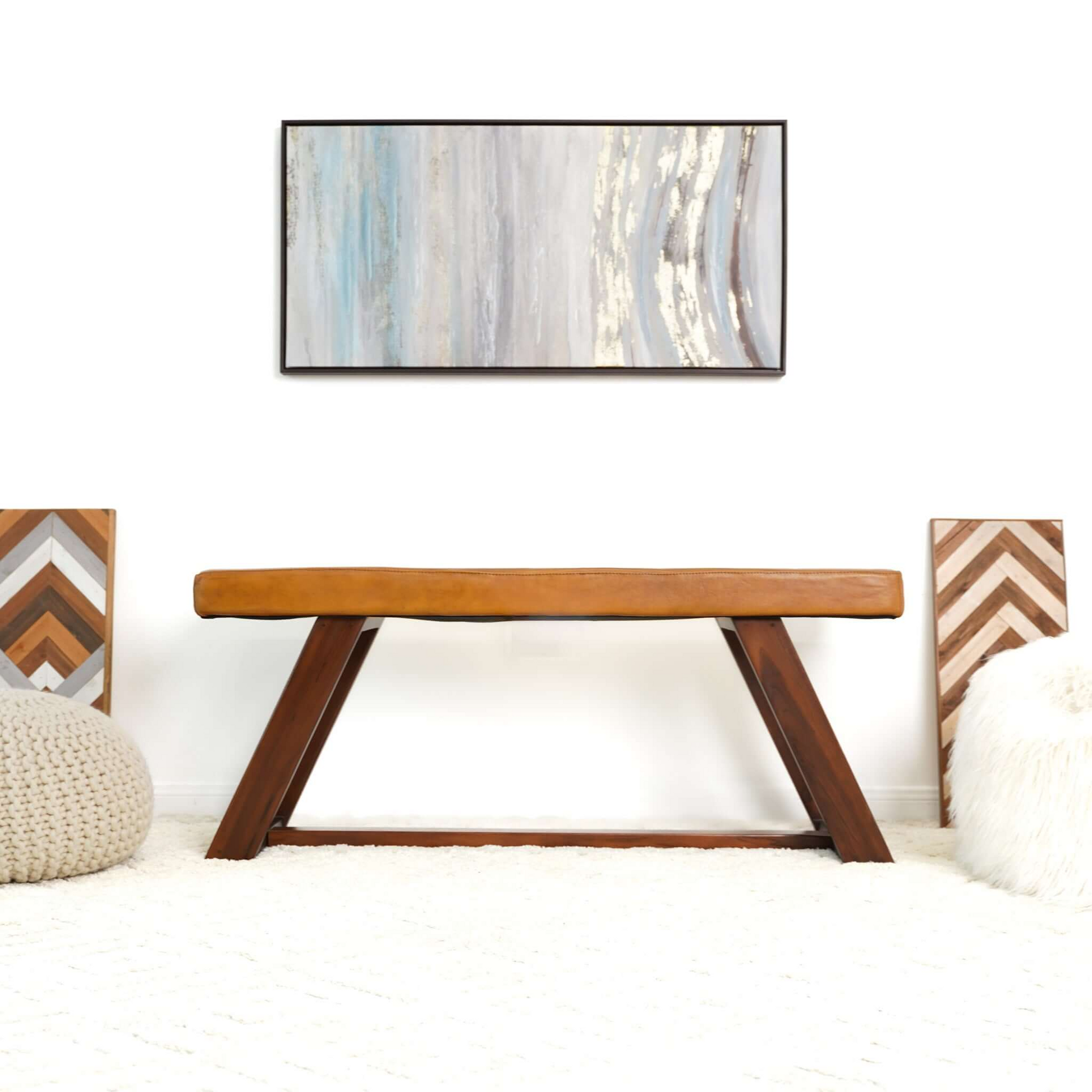 Tan leather bench with dark wood Aframe legs perfect for entryway seating