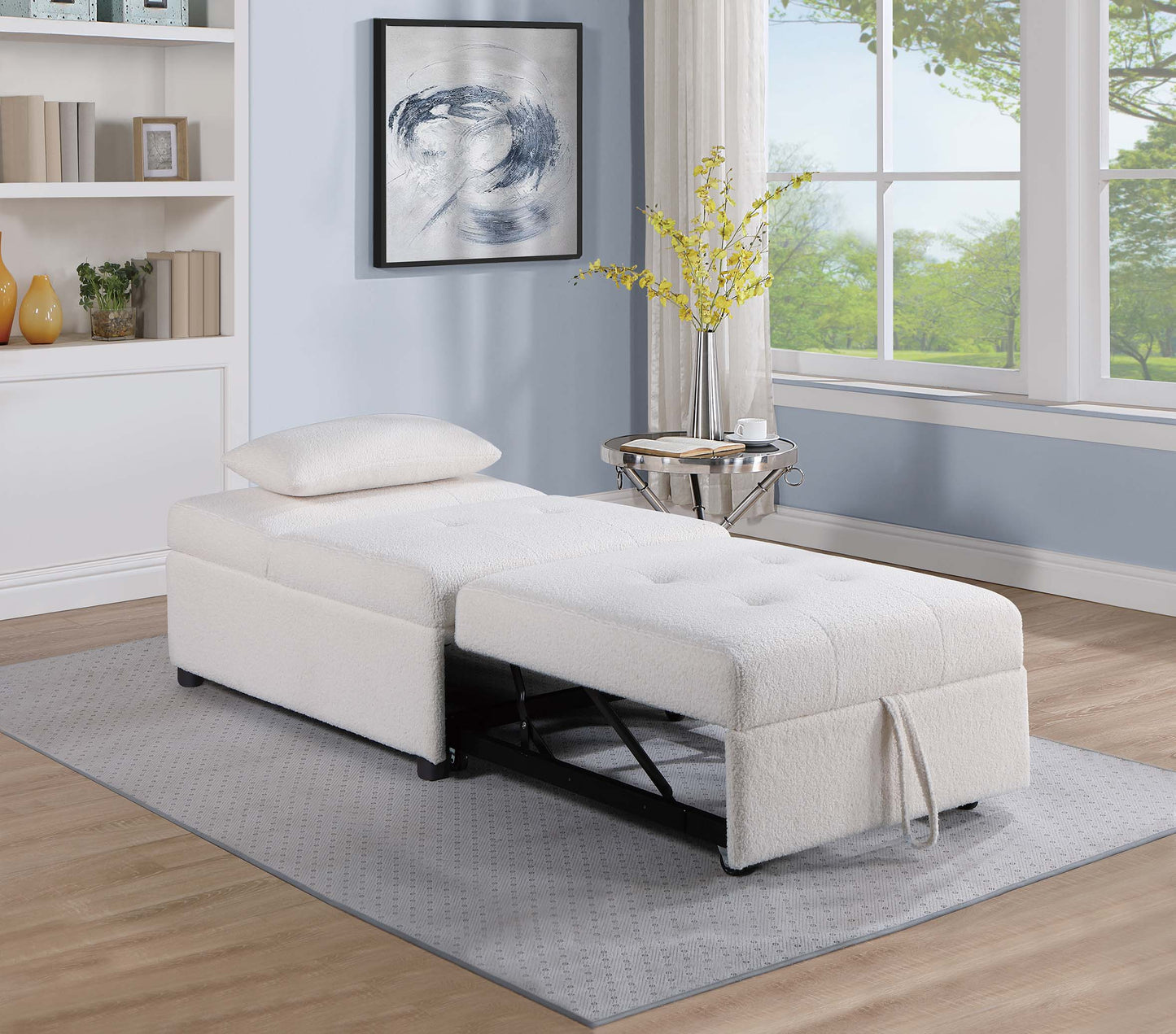 Cozy offwhite fabric convertible sofa bed with pullout ottoman on gray rug