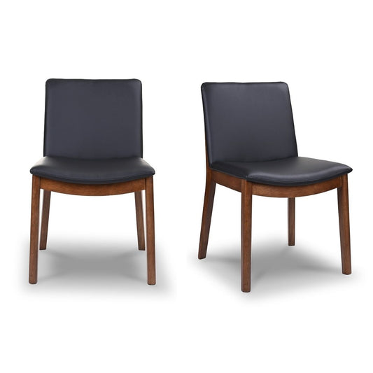 Two modern dining chairs with black faux leather seats and walnut wood frames