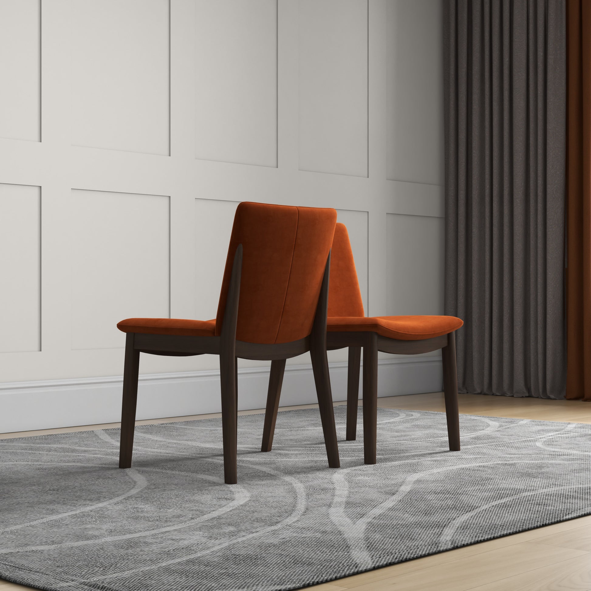Modern dining chair with rich orange upholstery and dark wood frame