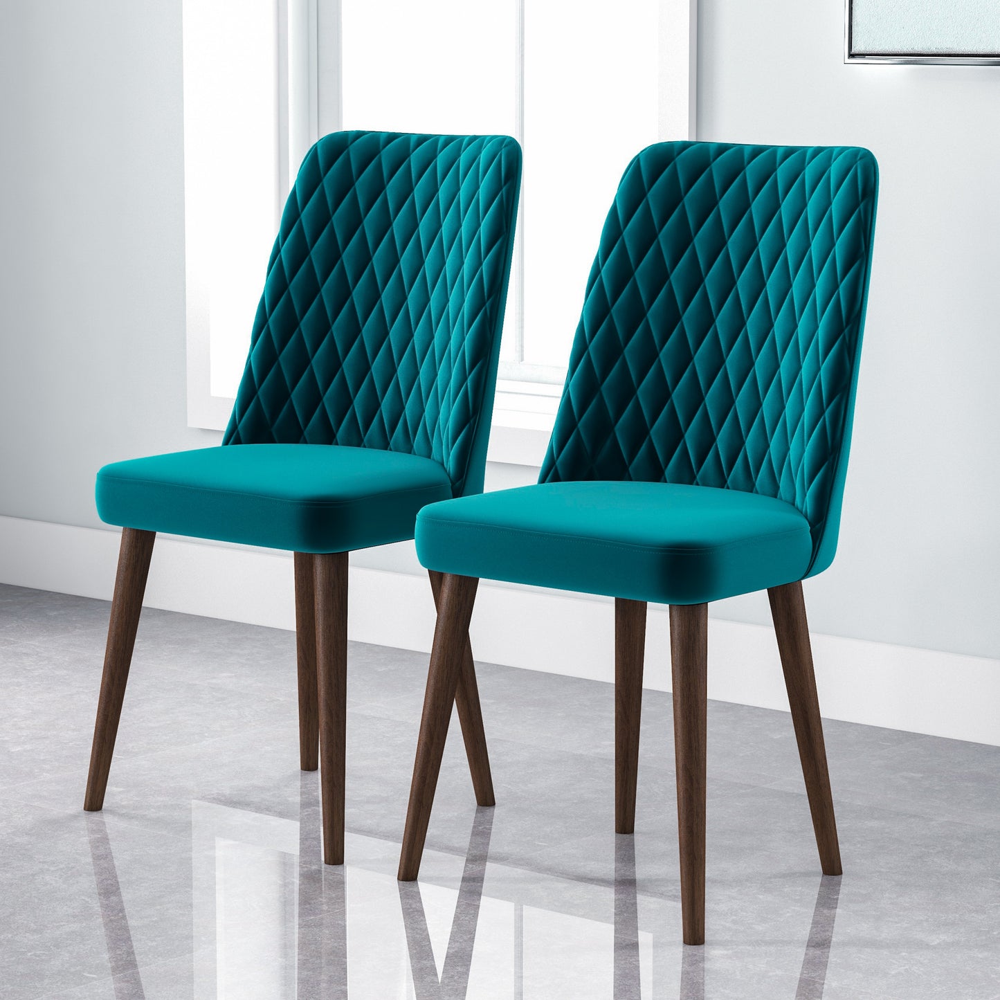 Two teal velvet diamondtufted accent chairs with dark wood legs