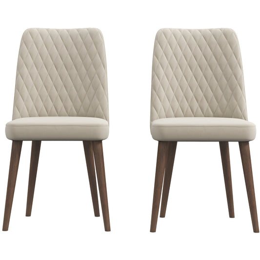 Two beige upholstered dining chairs with diamond tufting and dark wood legs