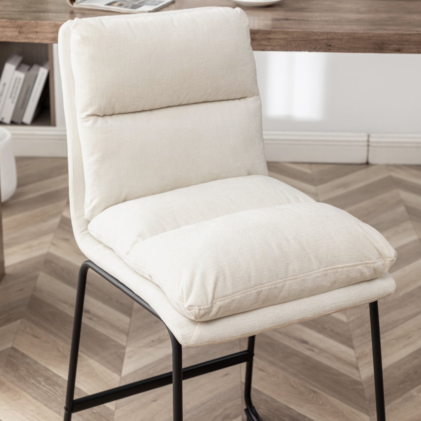 Comfortable cream fabric accent chair with cushioned seat and back