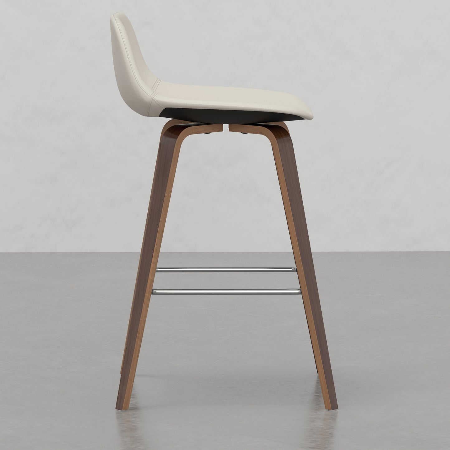 Cream leather bar stool with curved wood frame and chrome footrest