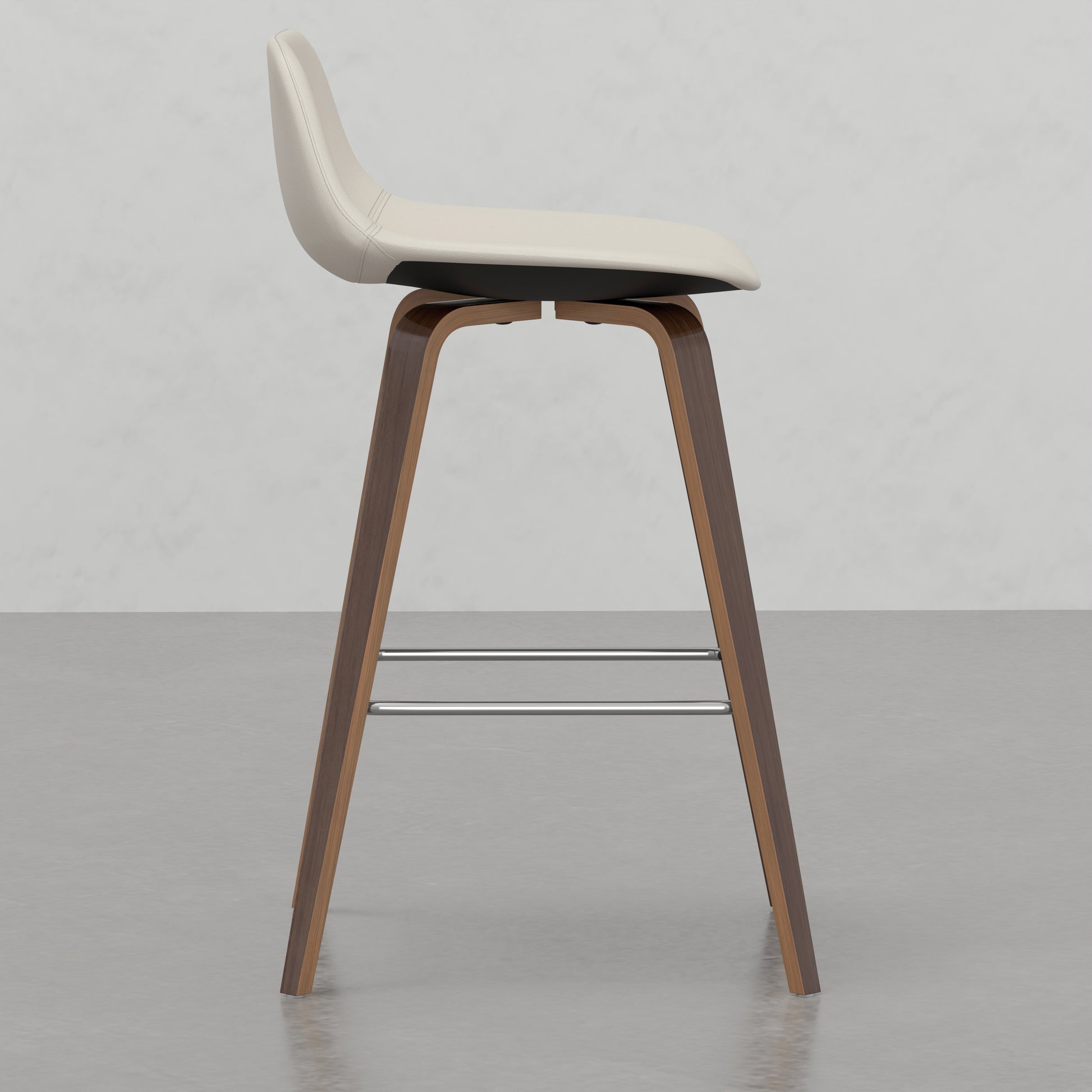 Cream leather bar stool with curved wood frame and chrome footrest