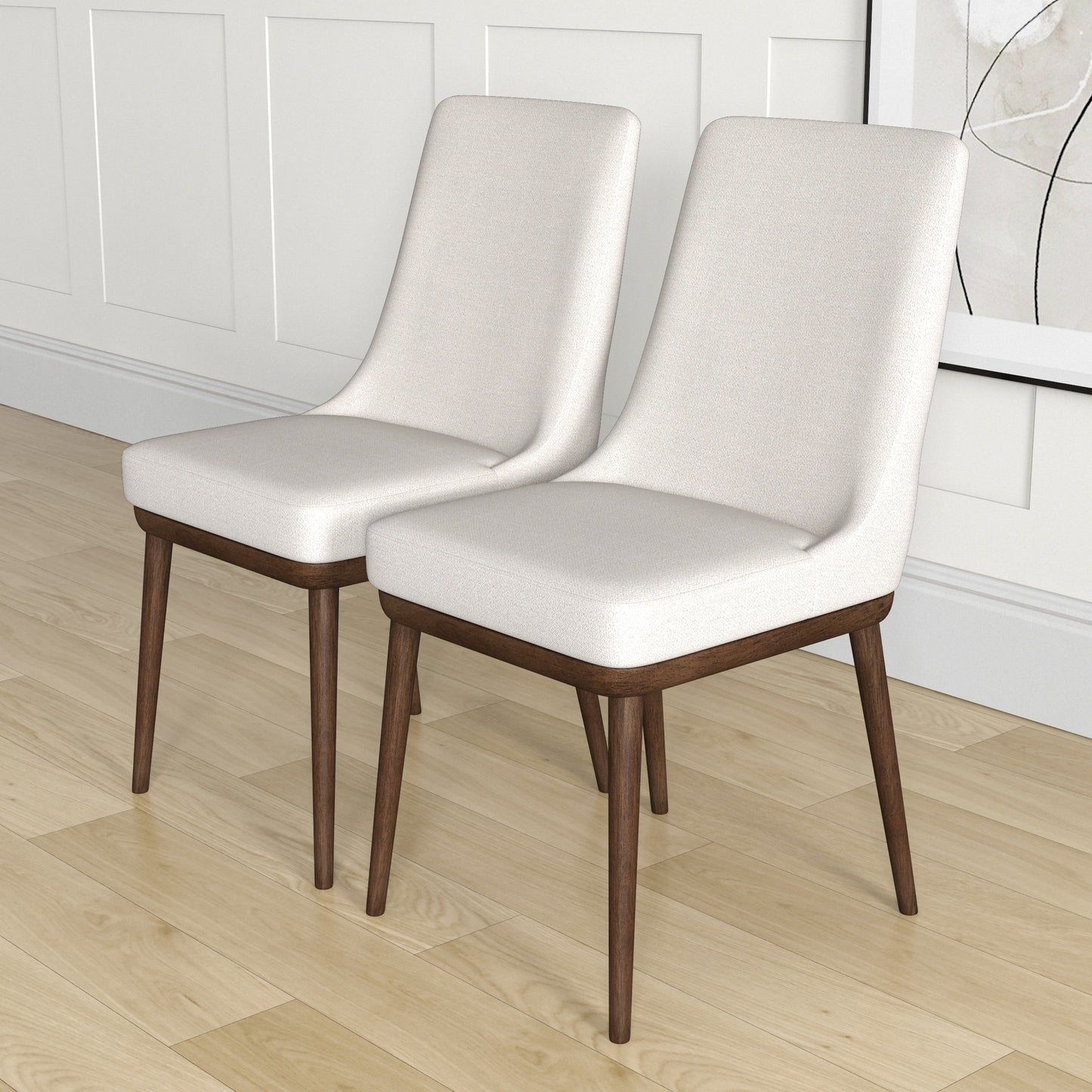 Two light beige upholstered dining chairs with dark wood tapered legs