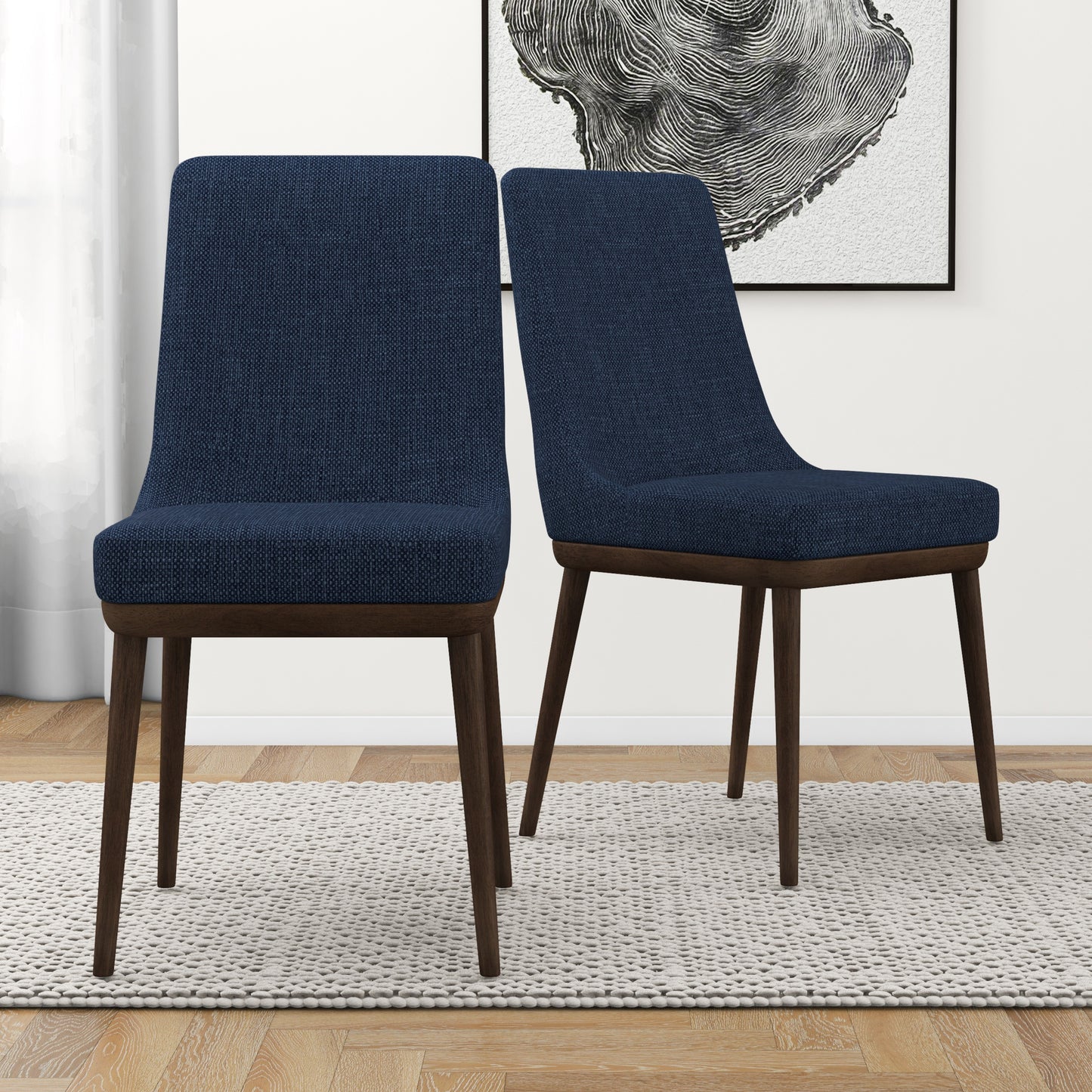 Two upholstered dining chairs in navy blue fabric with dark wood legs ideal for modern kitchens