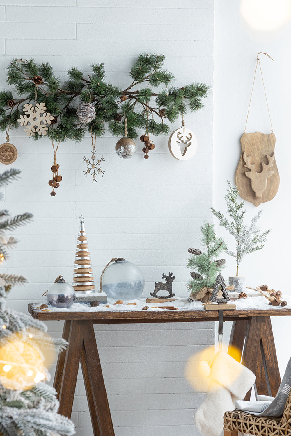 Wooden snowflake ornament with rustic pine garland and Christmas decor