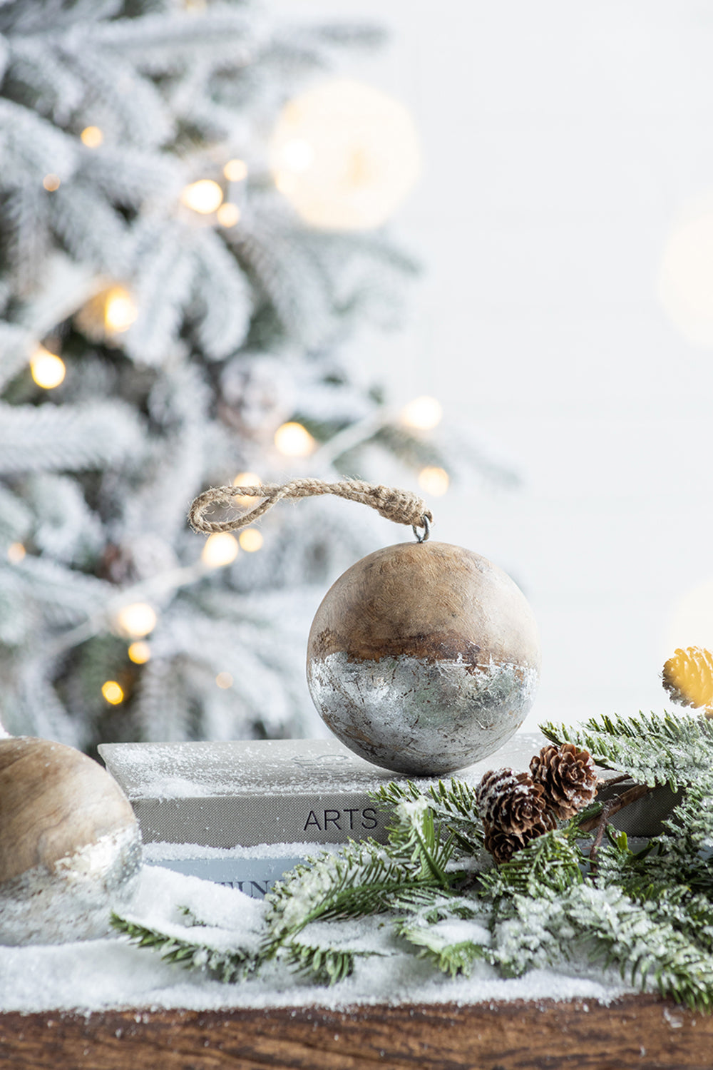 Rustic wooden Christmas ornament with distressed silver base and jute hanger