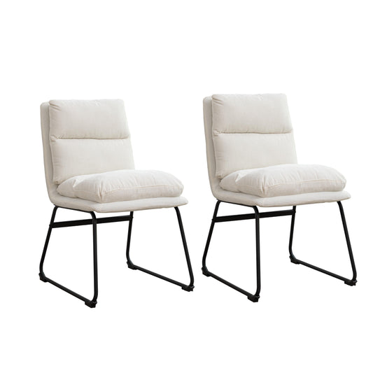 Two cream fabric accent chairs with black metal legs