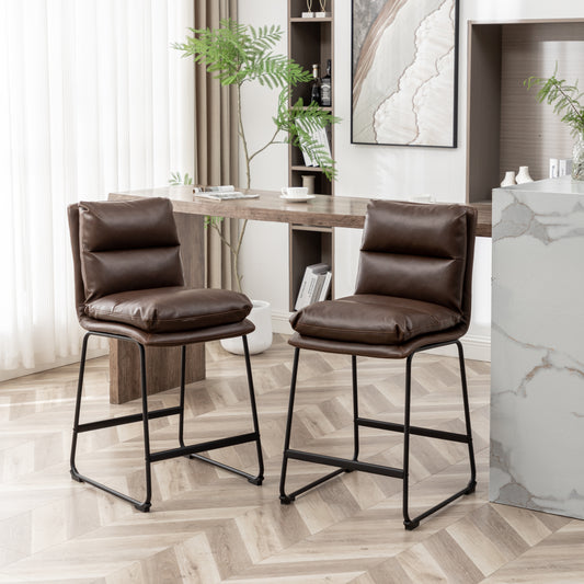 Two plush brown faux leather counter height bar stools with black metal legs