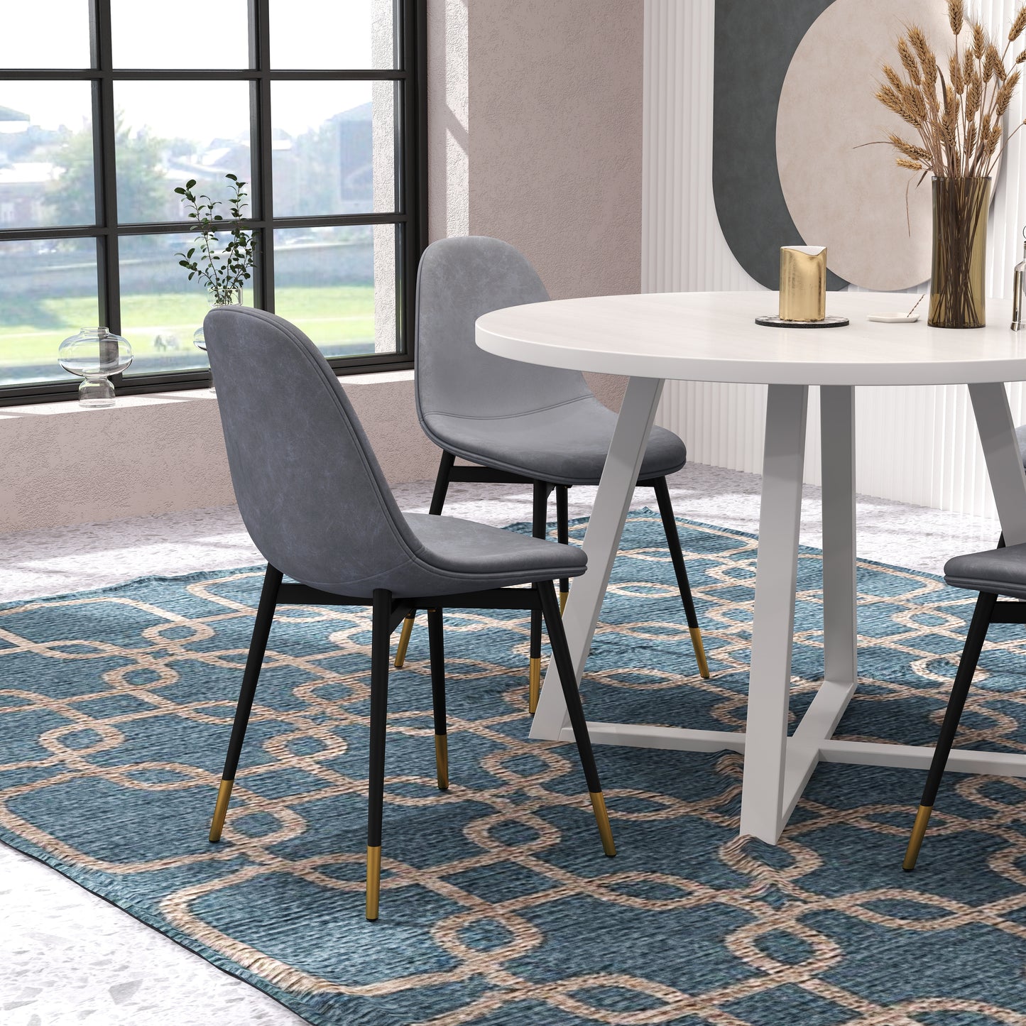 Grey upholstered dining chair with black legs and gold accents