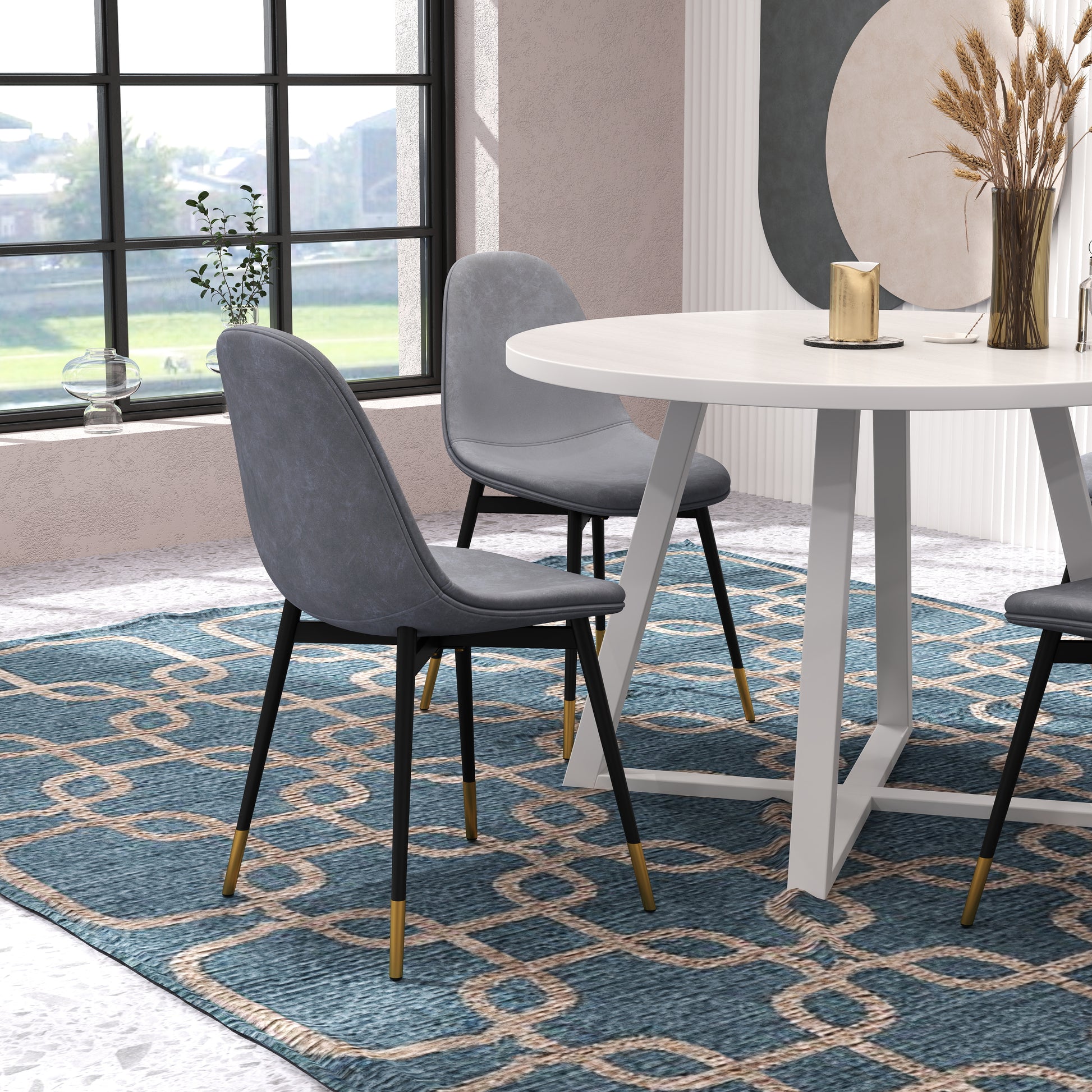 Grey upholstered dining chair with black legs and gold accents
