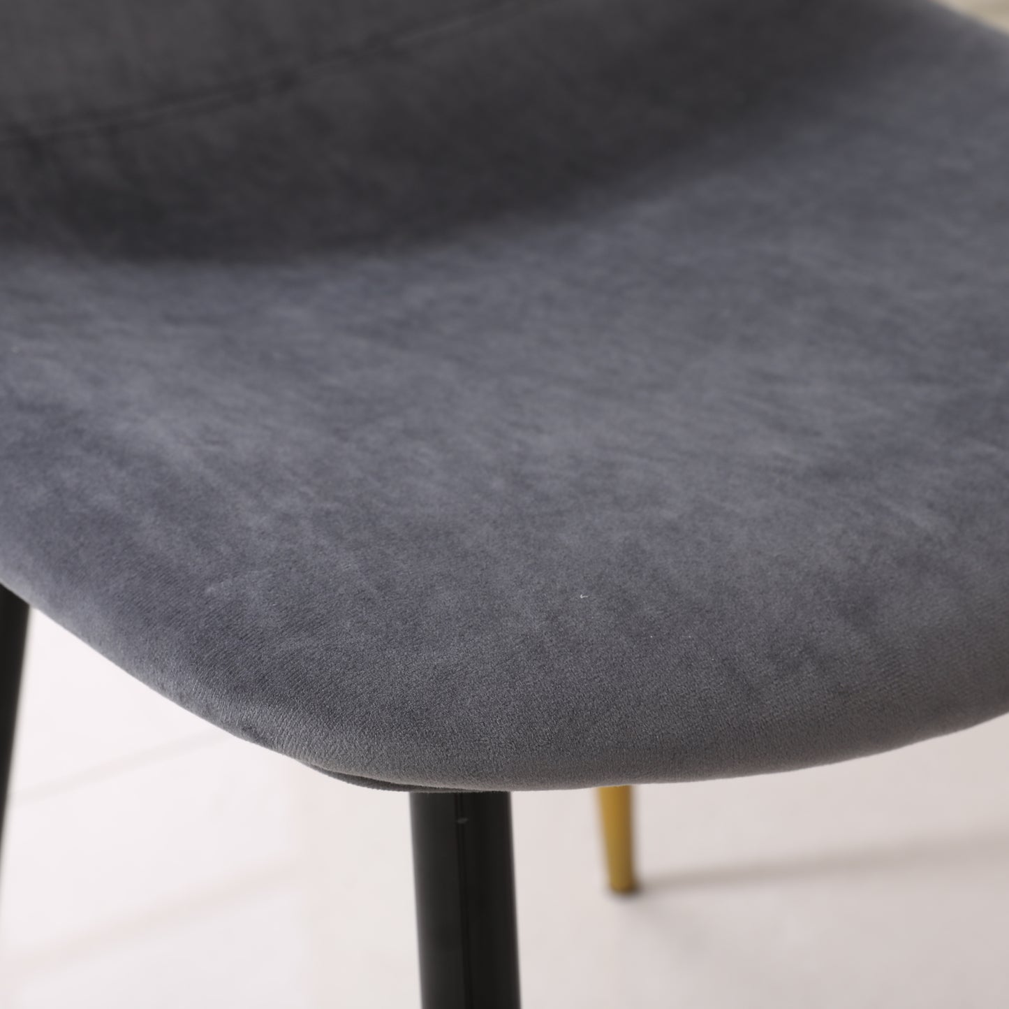 Dark gray velvet dining chair seat with black metal legs