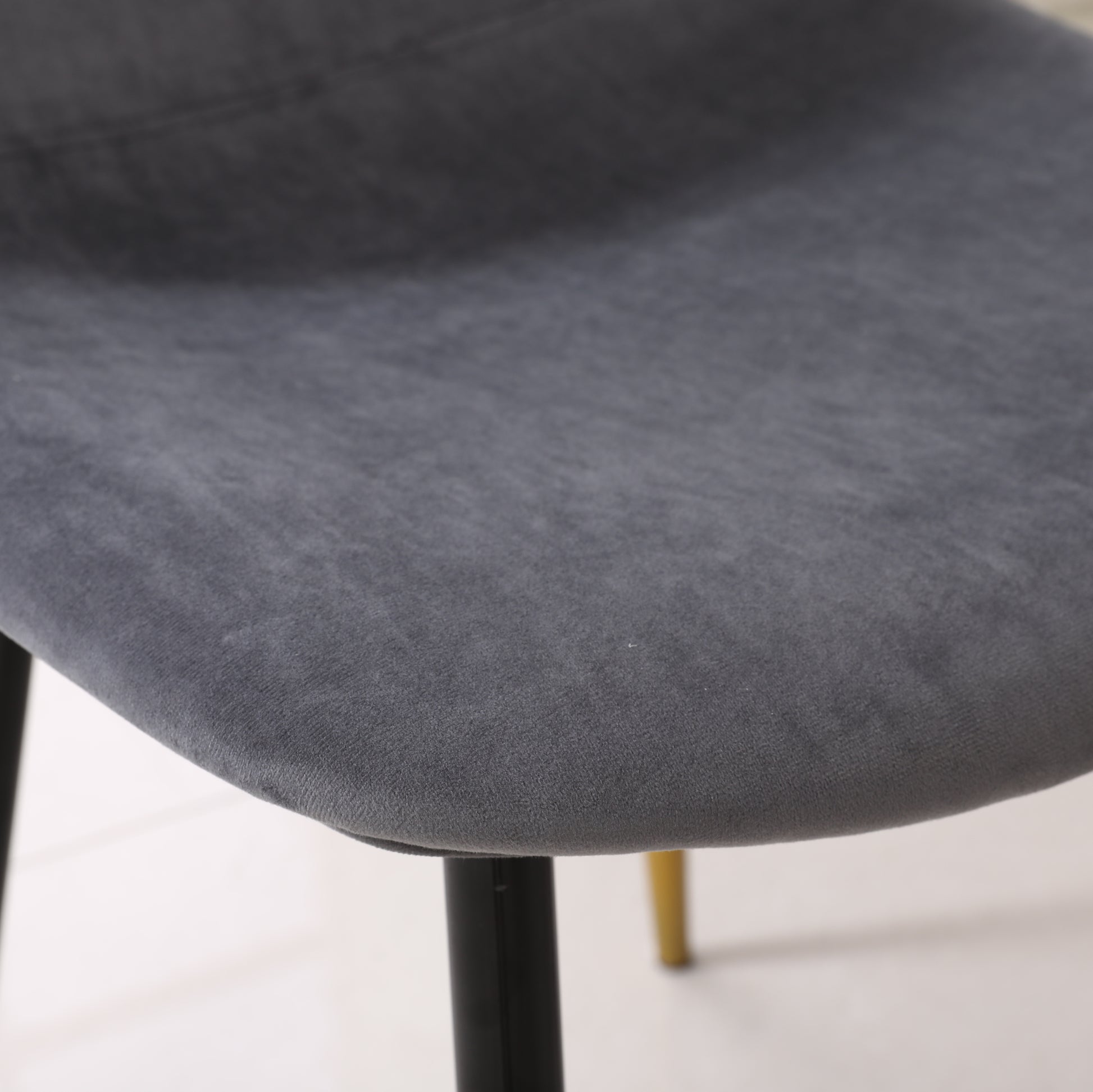 Dark gray velvet dining chair seat with black metal legs