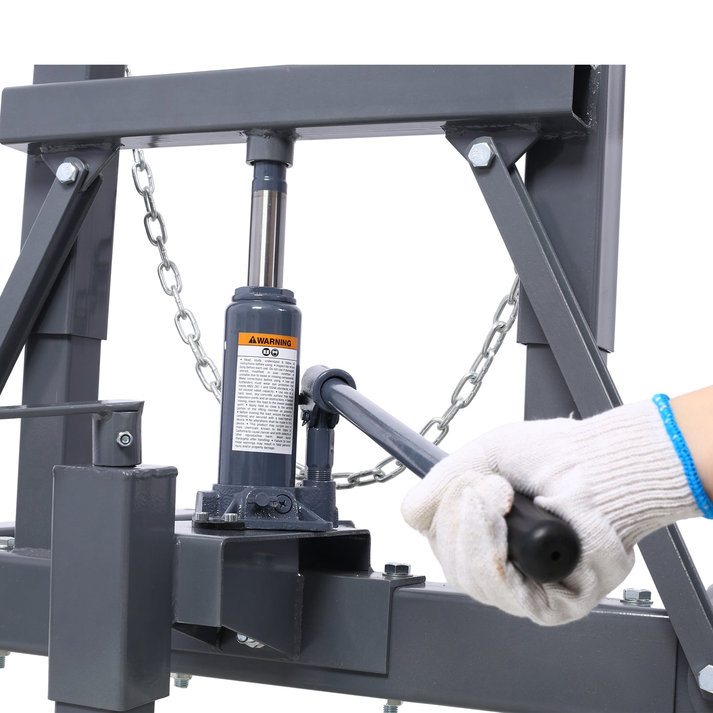 Gray steel hydraulic press with a hand in a white glove operating the lever