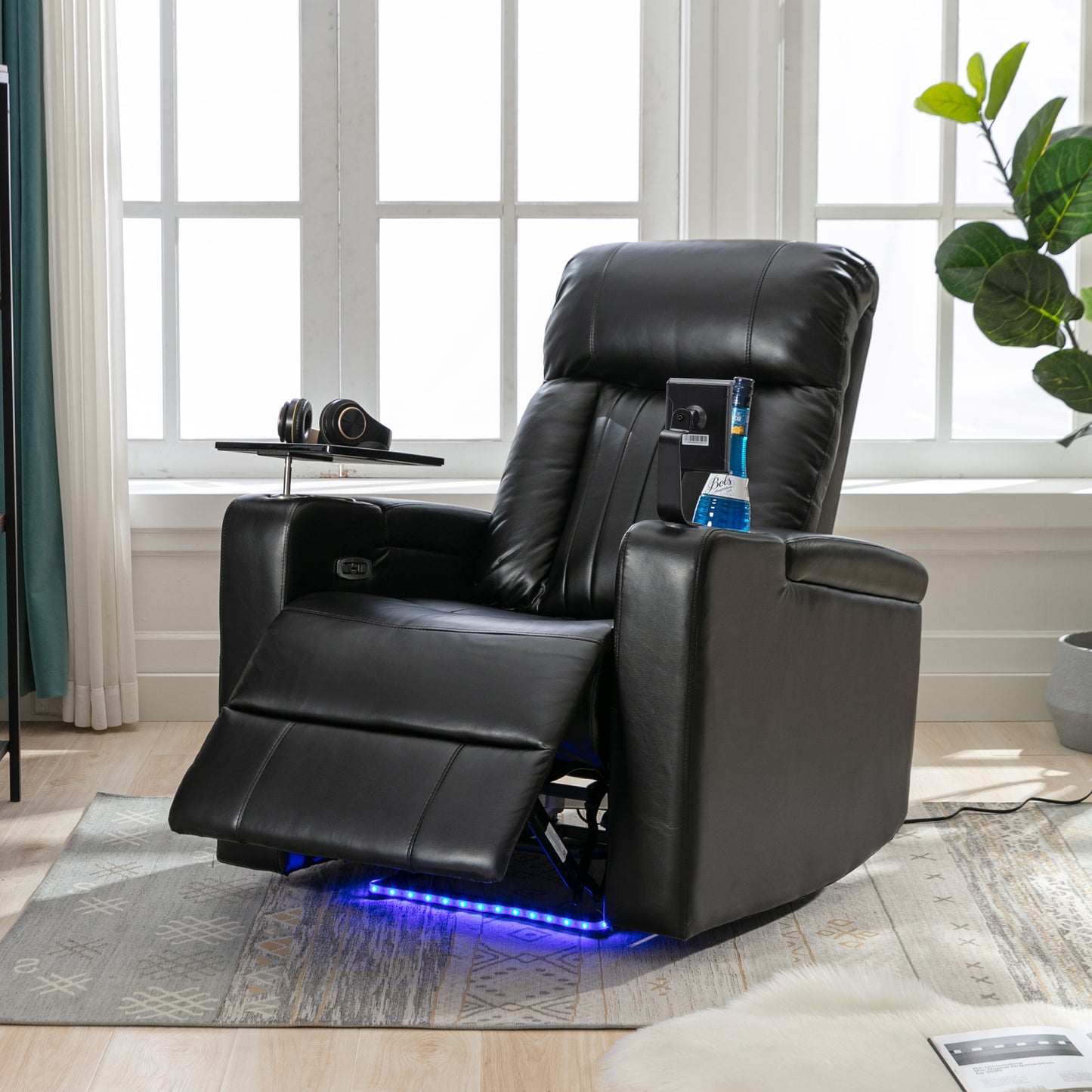 Black leather recliner chair with builtin cup holder and LED base lighting for home theater comfort