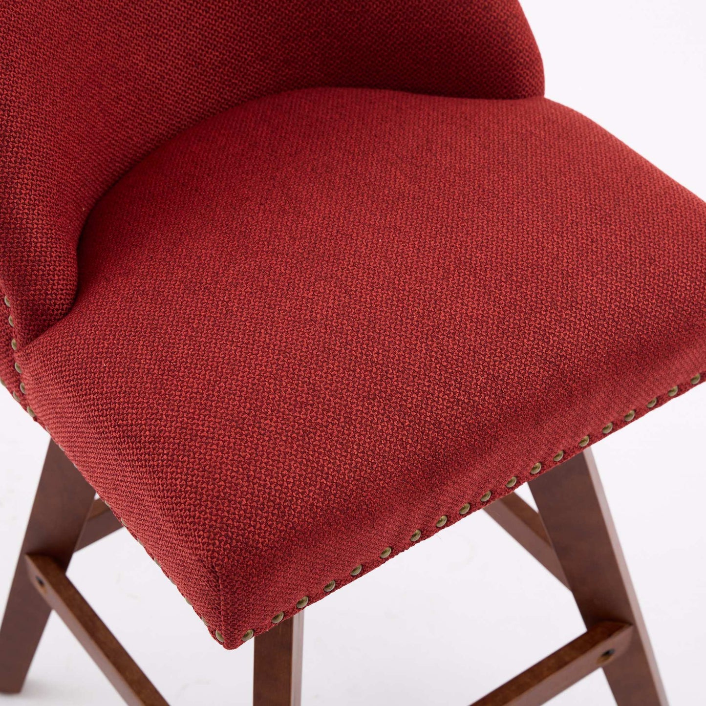 Red textured fabric bar stool with nailhead trim and wooden legs