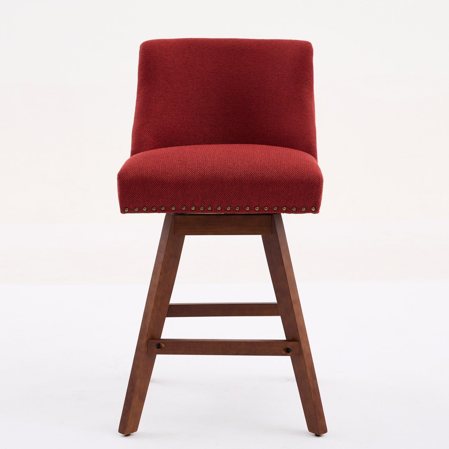 Red upholstered swivel bar stool with wooden base and nailhead trim
