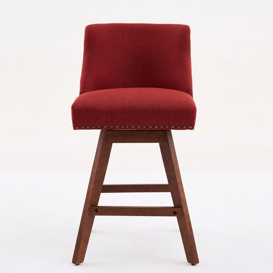 Red upholstered swivel bar stool with wooden base and nailhead trim