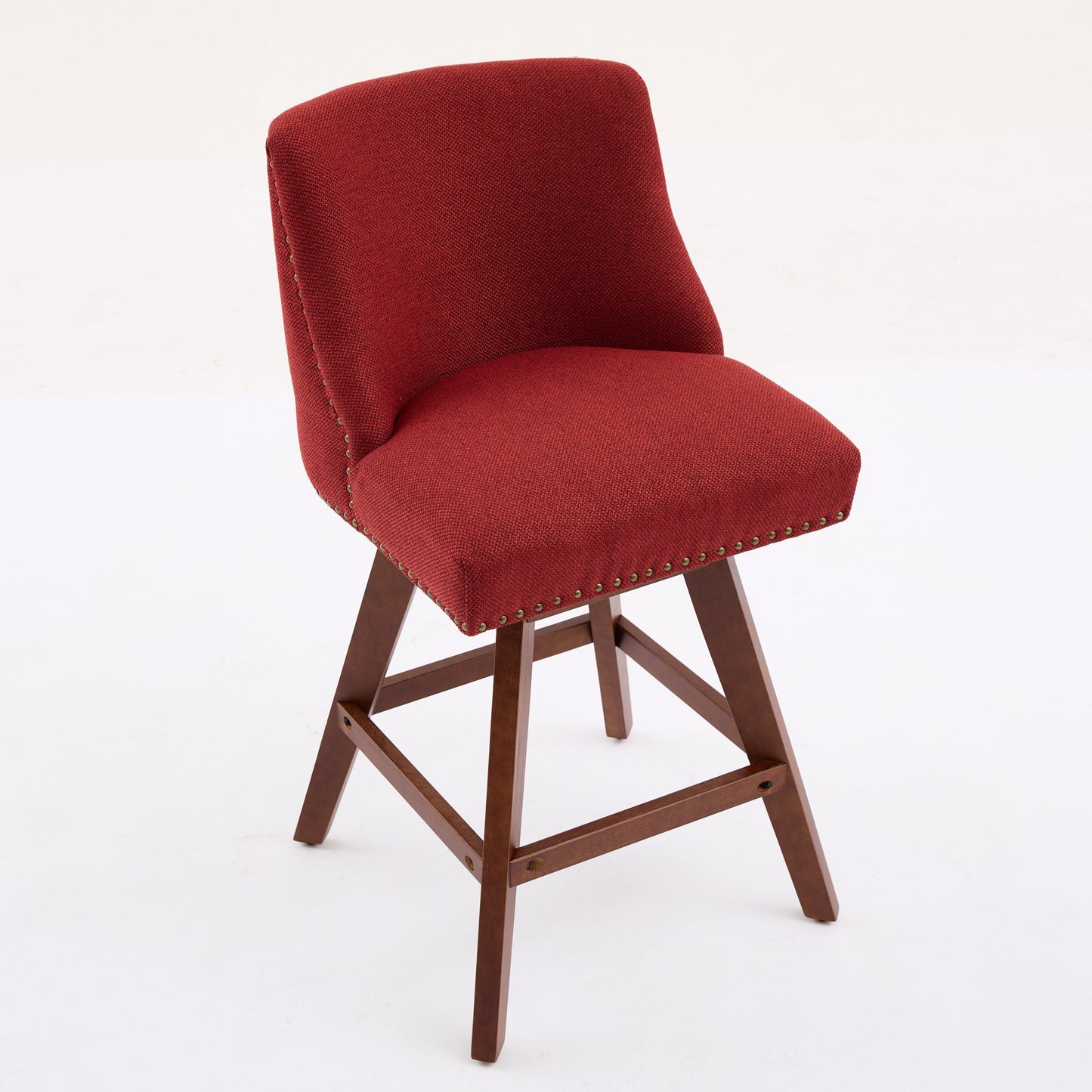 Red upholstered swivel counter stool with nailhead trim and dark wood legs