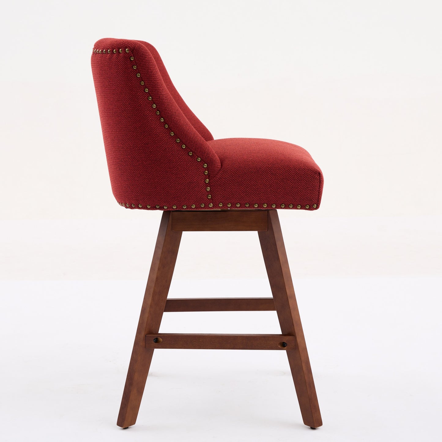 Red fabric swivel bar stool with wooden legs and brass nailhead trim