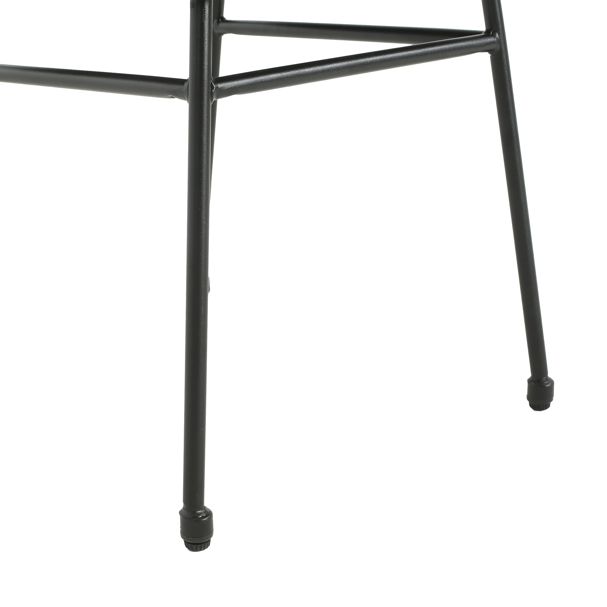 Closeup of black metal hairpin legs with protective caps for furniture stability