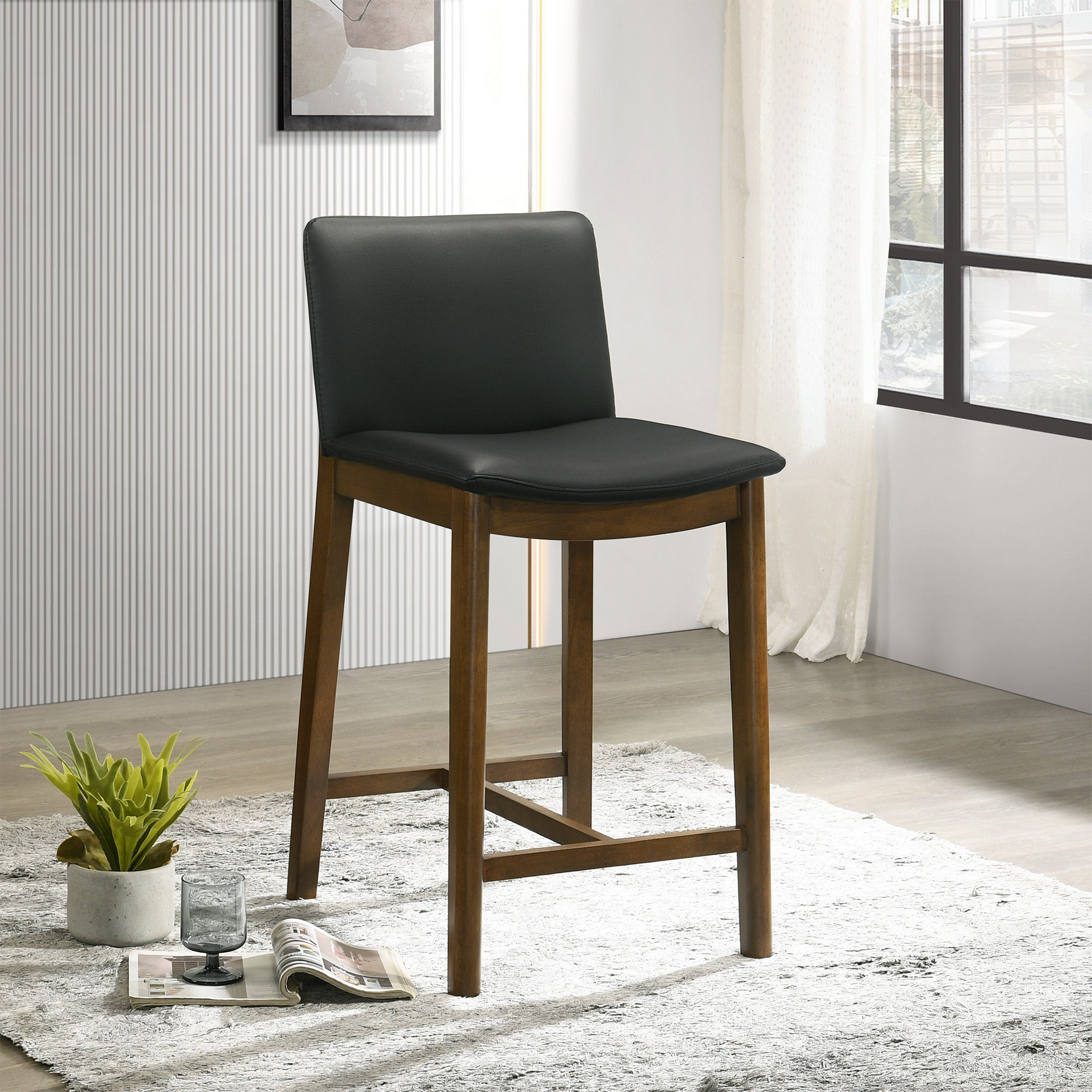 Black upholstered bar stool with a rich walnut wood frame ideal for kitchen islands