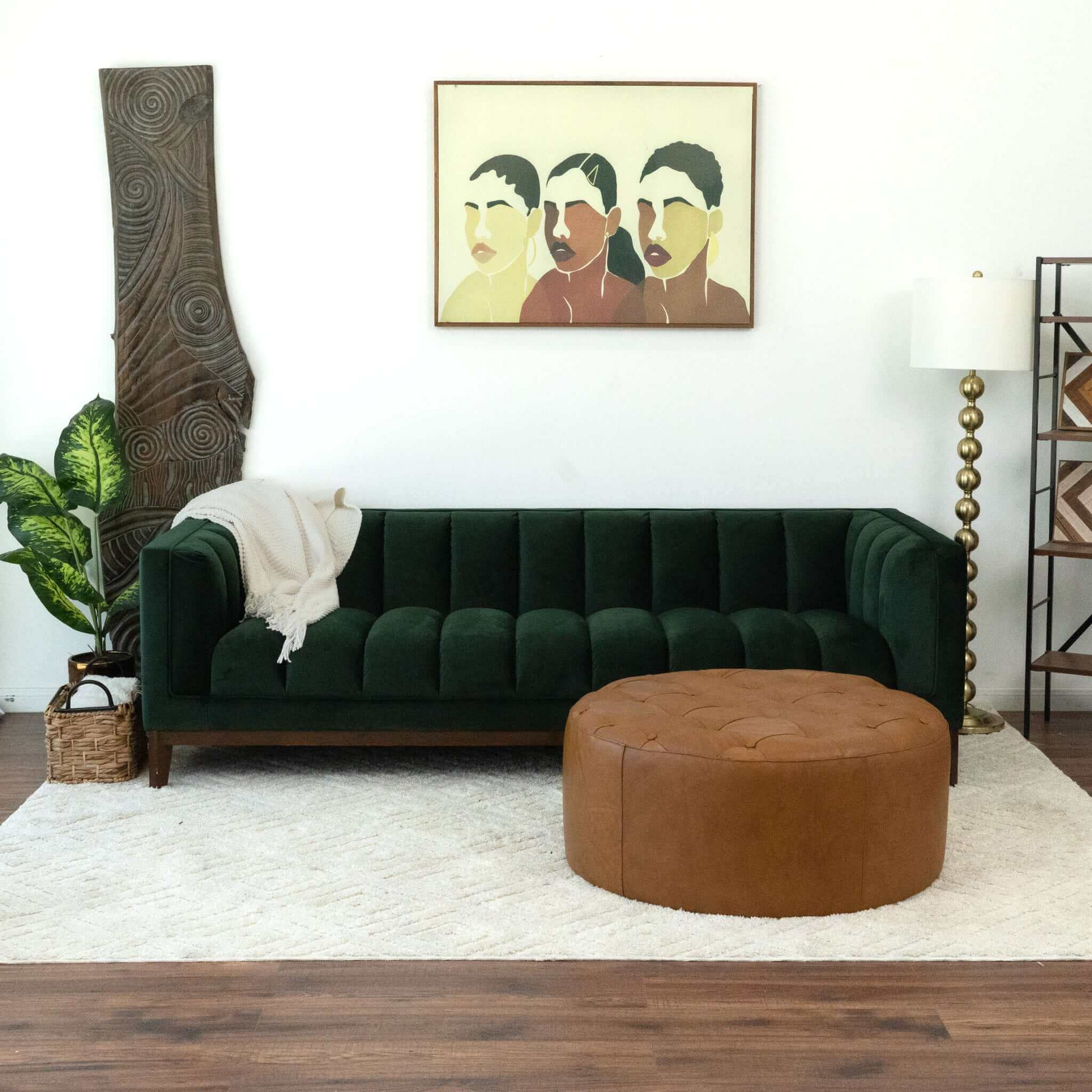 Deep green velvet tufted sofa with plush channel stitching for living room comfort