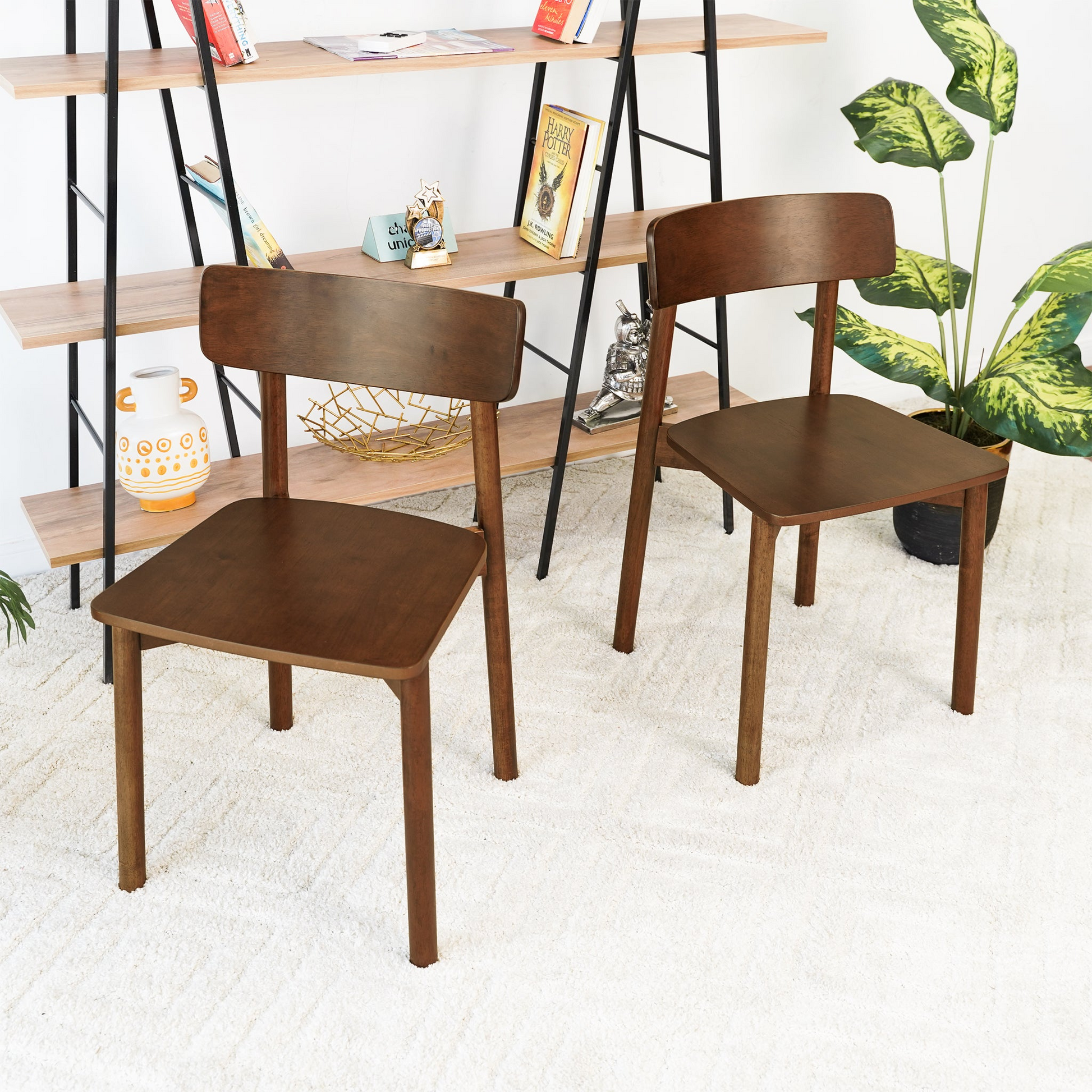 Dark wood modern dining chair with curved backrest on white shag rug