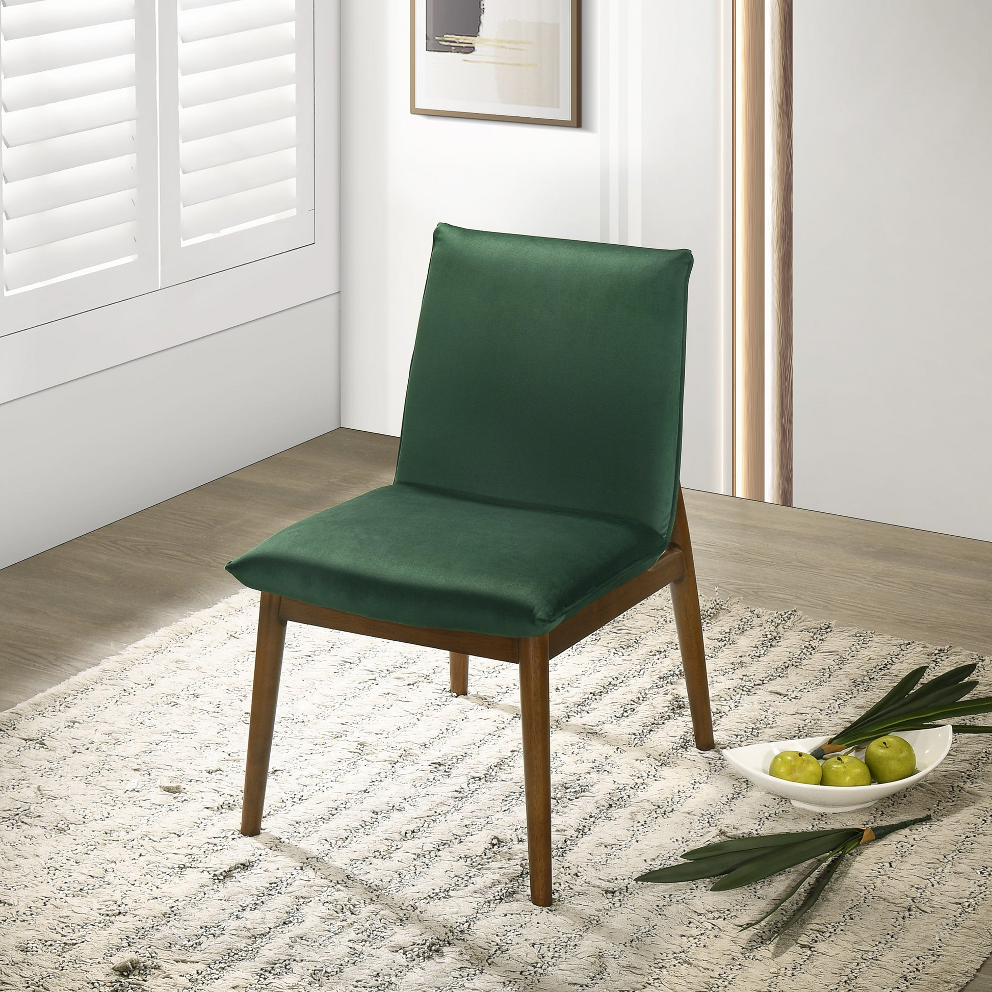 Emerald green velvet dining chair with dark wood legs modern style