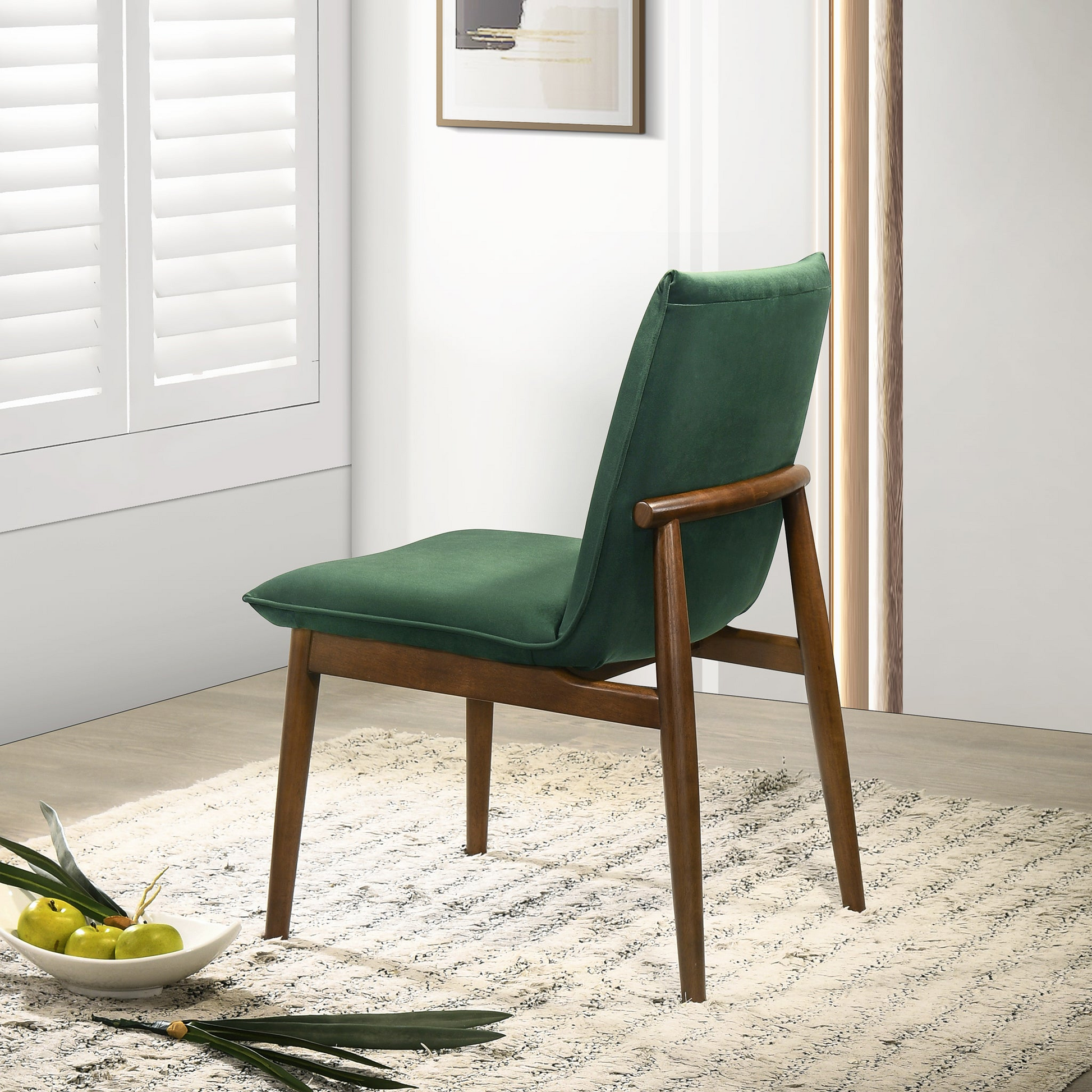 Emerald green velvet dining chair with walnut wood legs and back accent