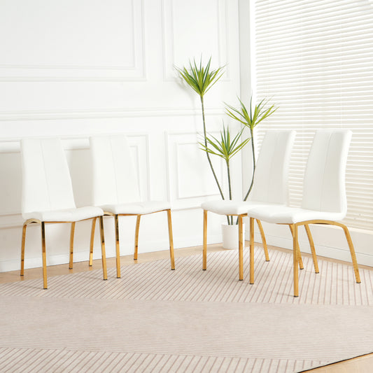Four white faux leather dining chairs with gold metal legs on a striped rug