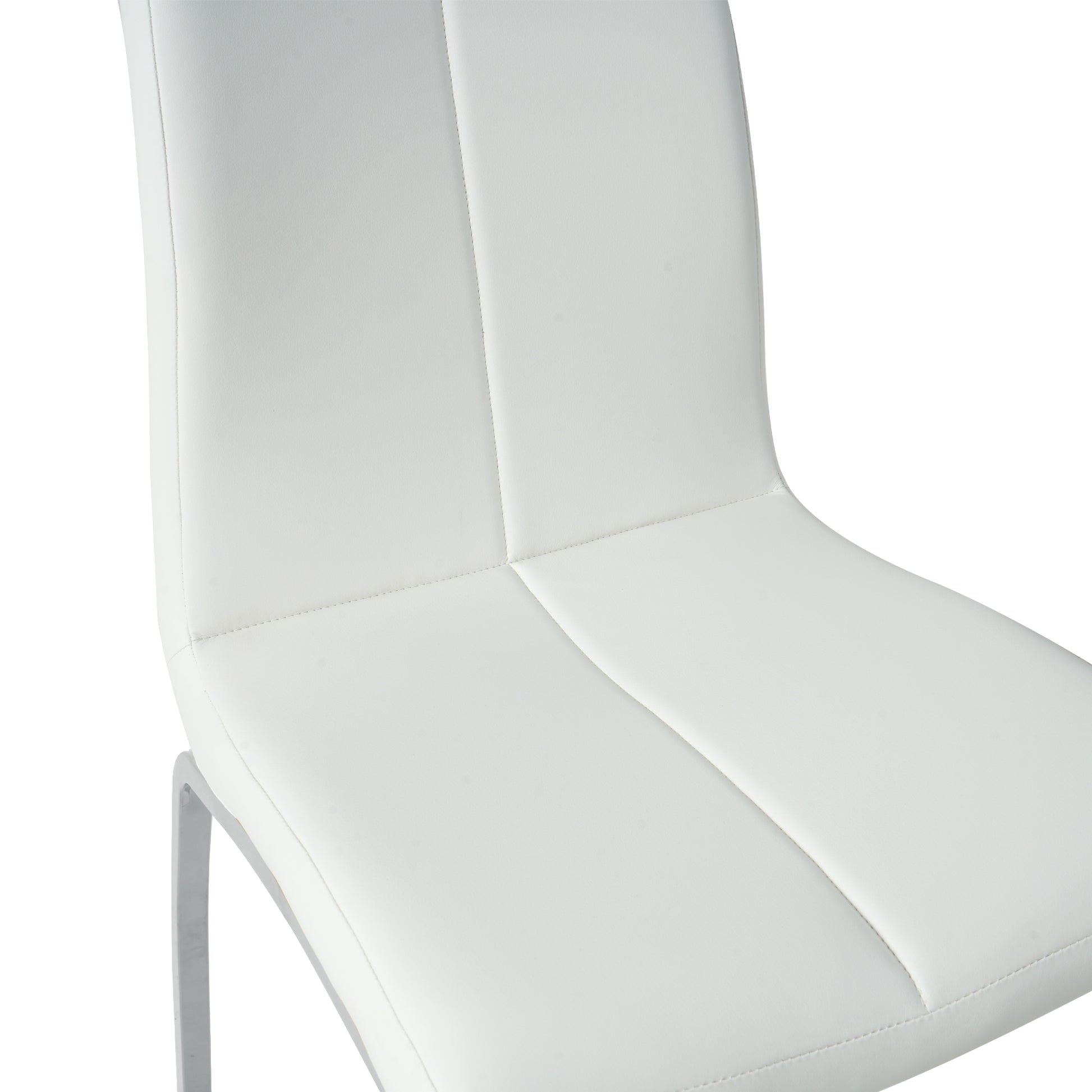 Closeup of a white leather dining chair with stitched detailing and a metal leg