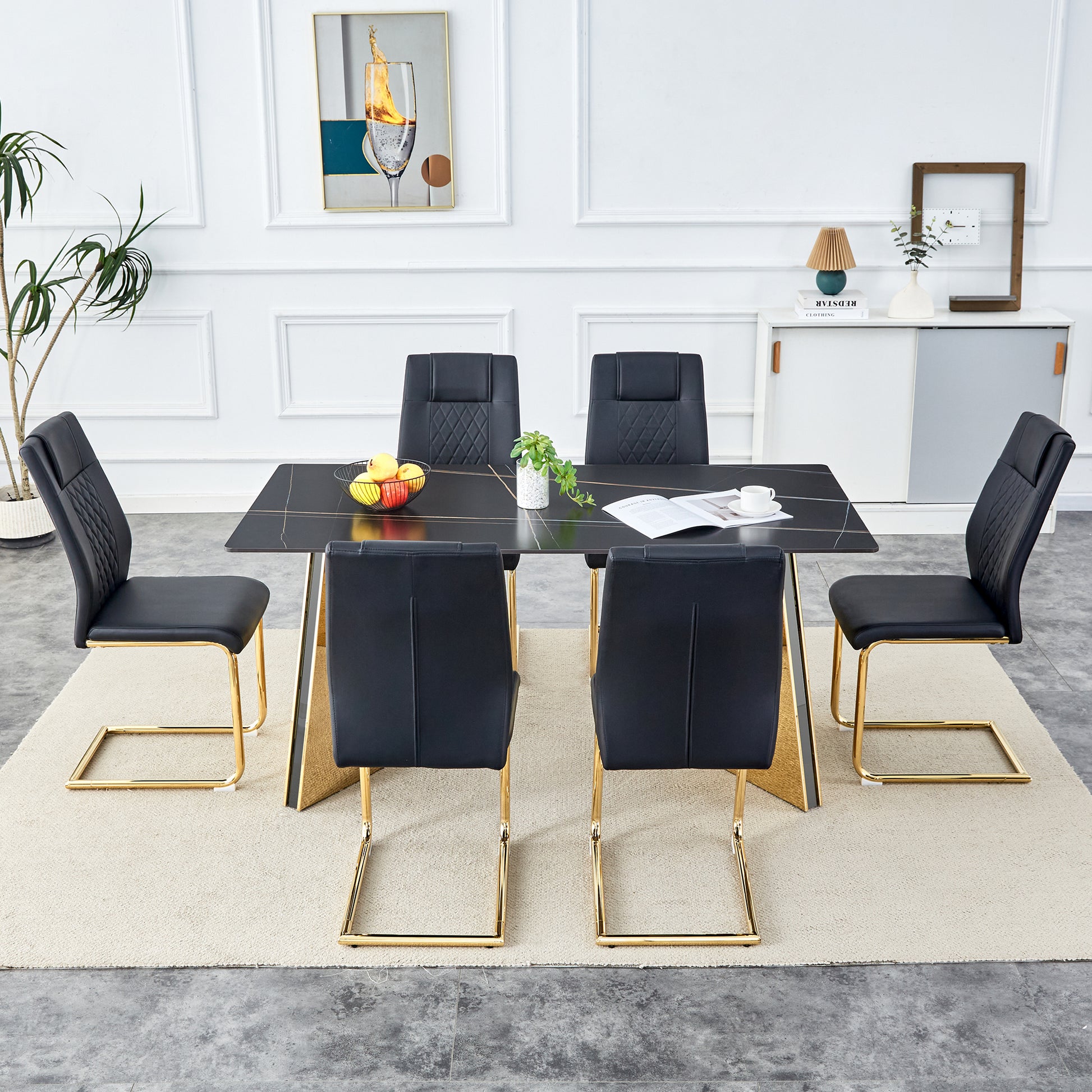 Modern black dining chairs with gold cantilever legs and quilted backrests