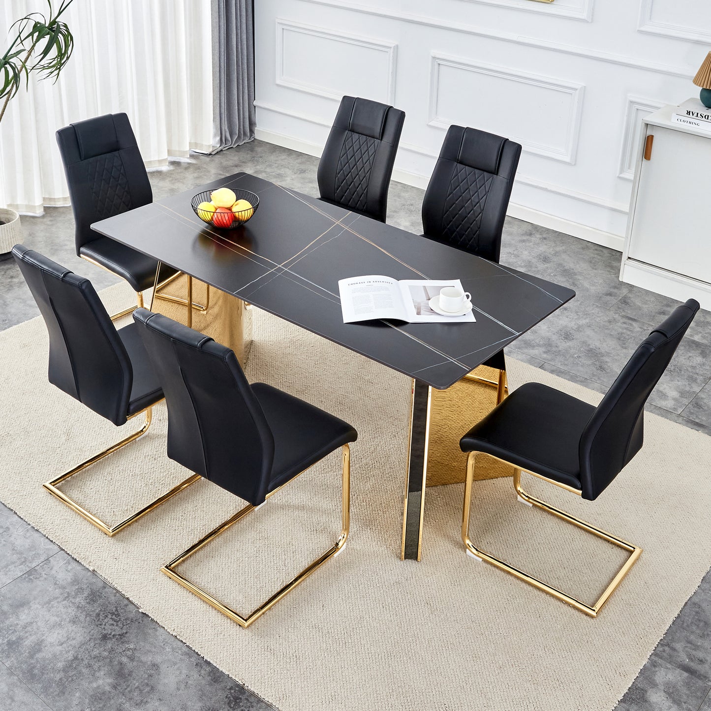 Black upholstered dining chairs with diamond tufting and gold sled legs complement a modern black marbletop table