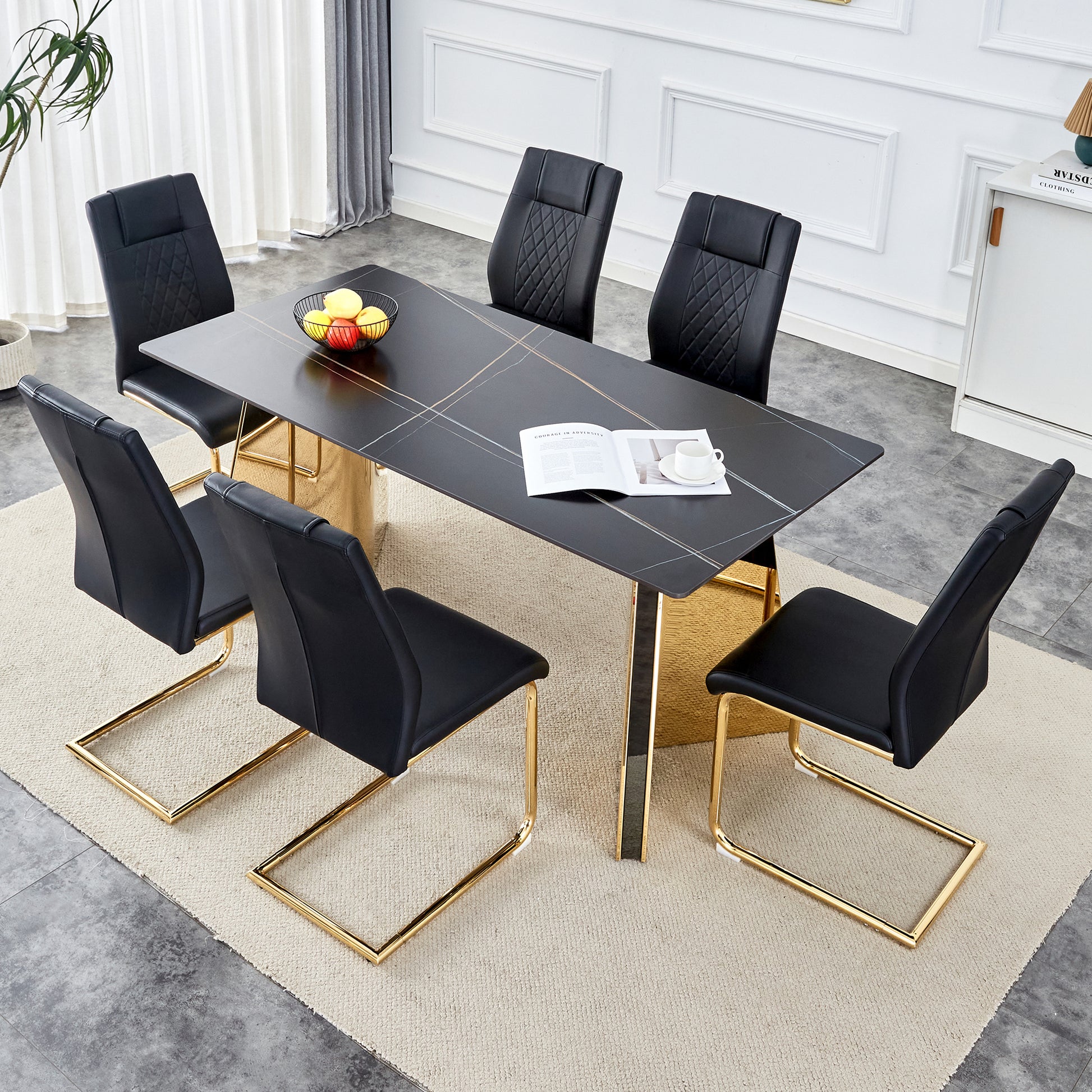 Black upholstered dining chairs with diamond tufting and gold sled legs complement a modern black marbletop table