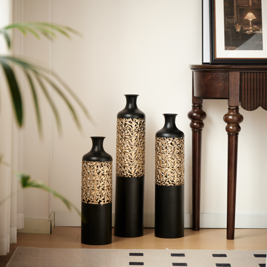 Set of three tall black floor vases with ornate gold filigree detailing modern home decor