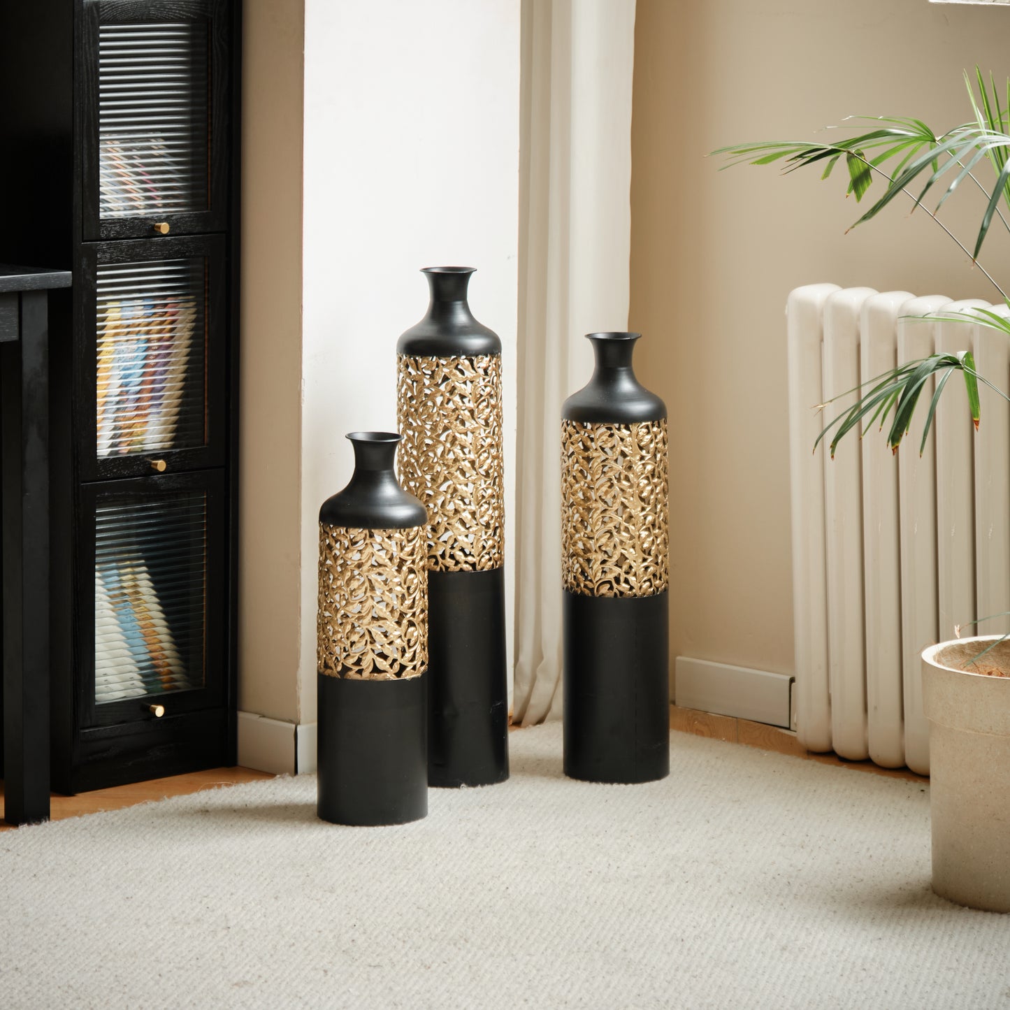 Set of three tall black vases with gold filigree accents decorative floor vases