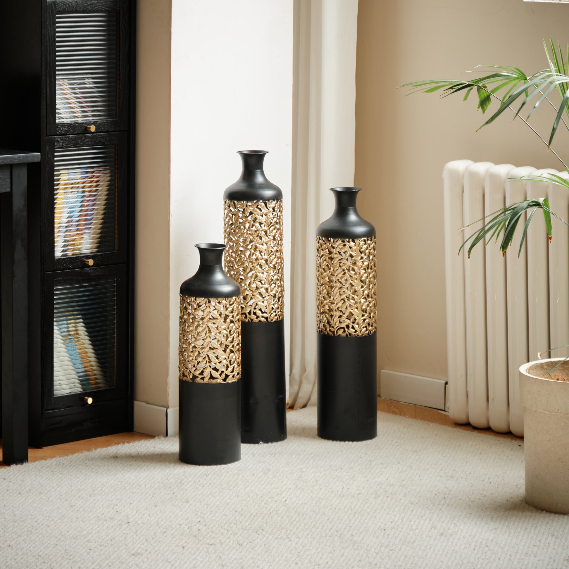 Set of three tall black vases with gold filigree accents decorative floor vases