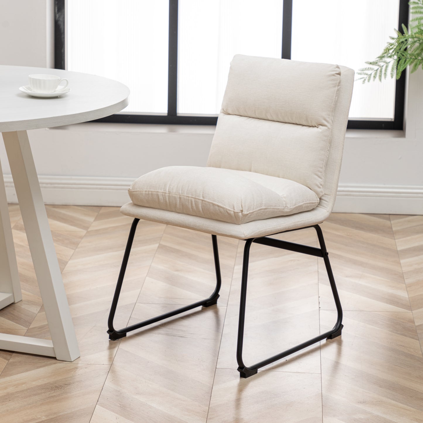 Cream fabric accent chair with black metal legs perfect for modern dining